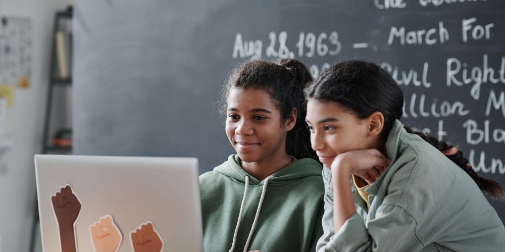 Two young students learn about Black History