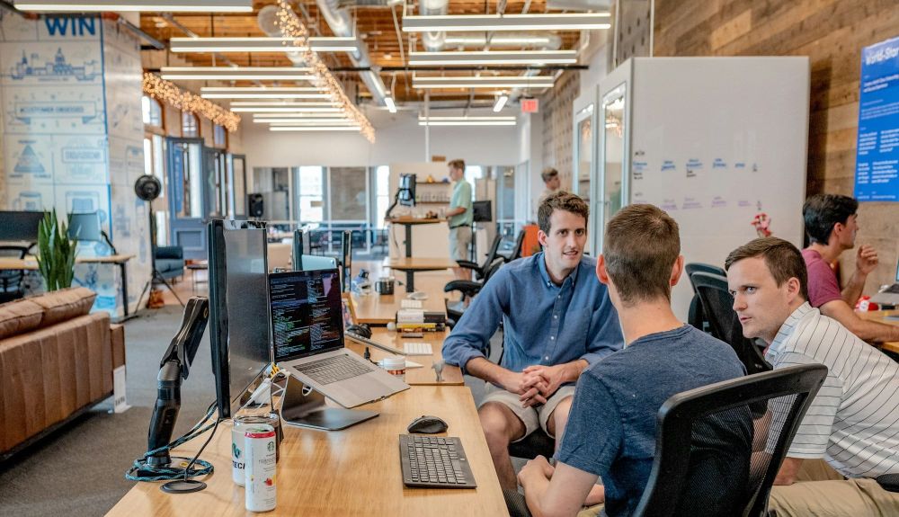 A group of employees discuss their next career move