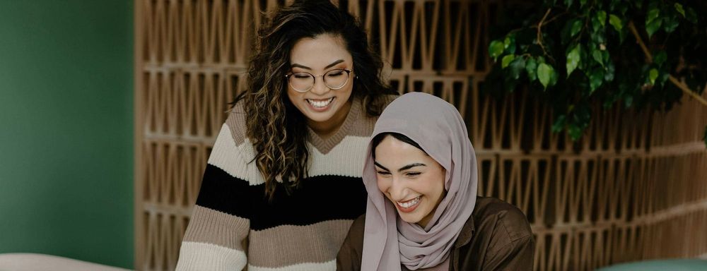 Two women collaborating
