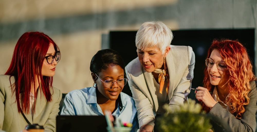 A team reviews the mentor and sponsor programs in their inclusive business