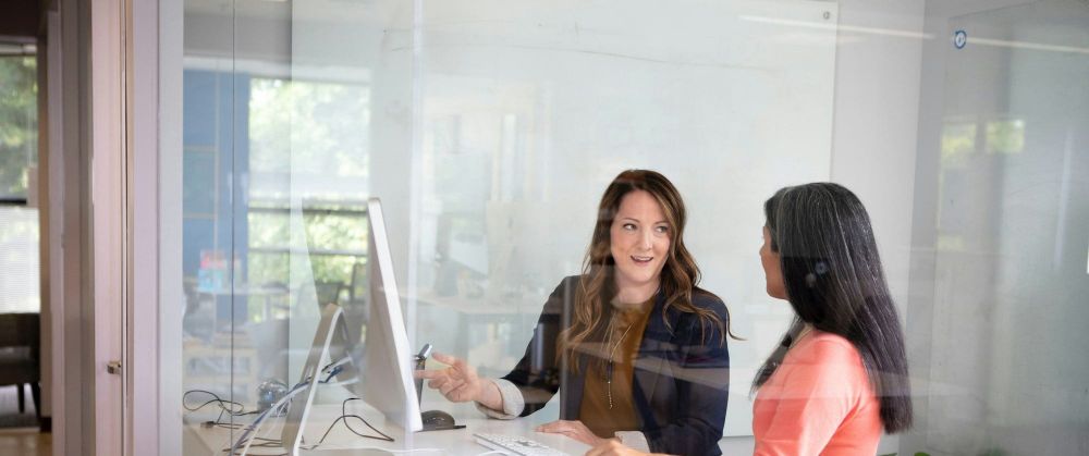 Two women discuss their workplace trends