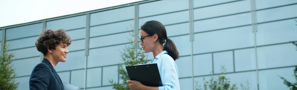 Two employees discuss DEI