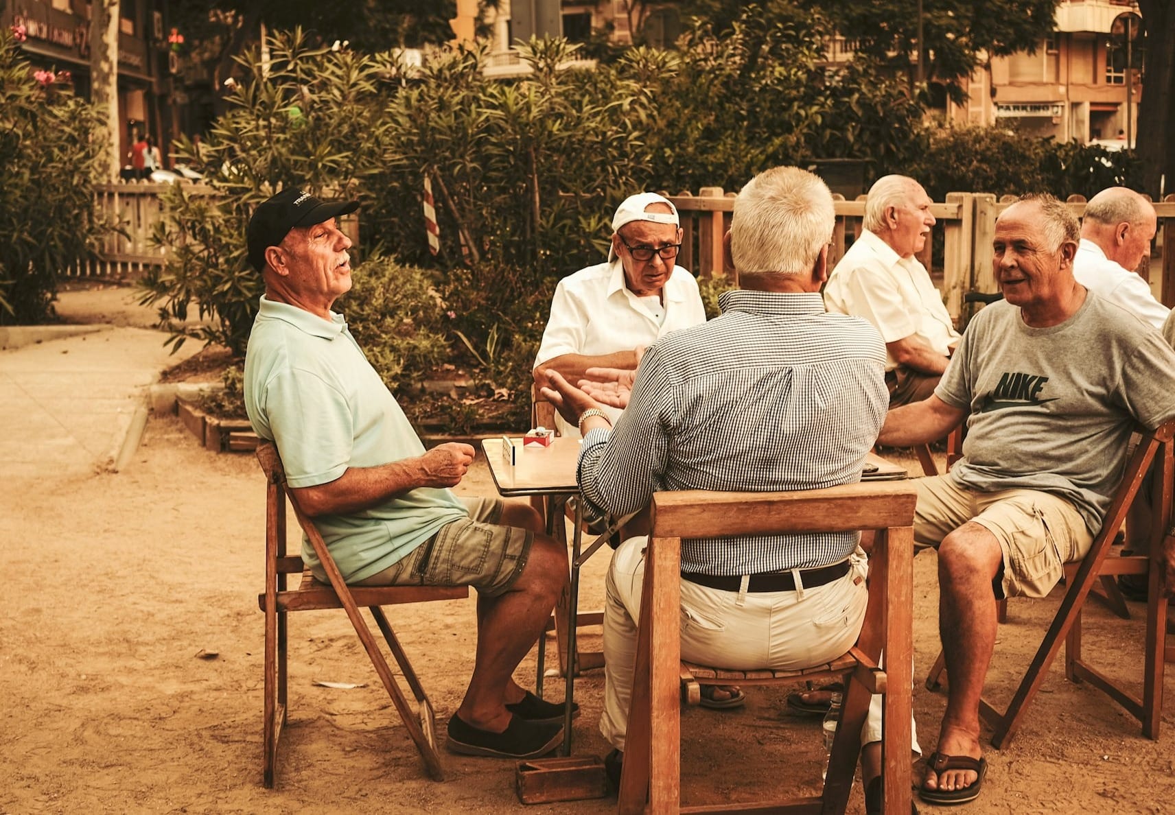 group of old men sitting near table
