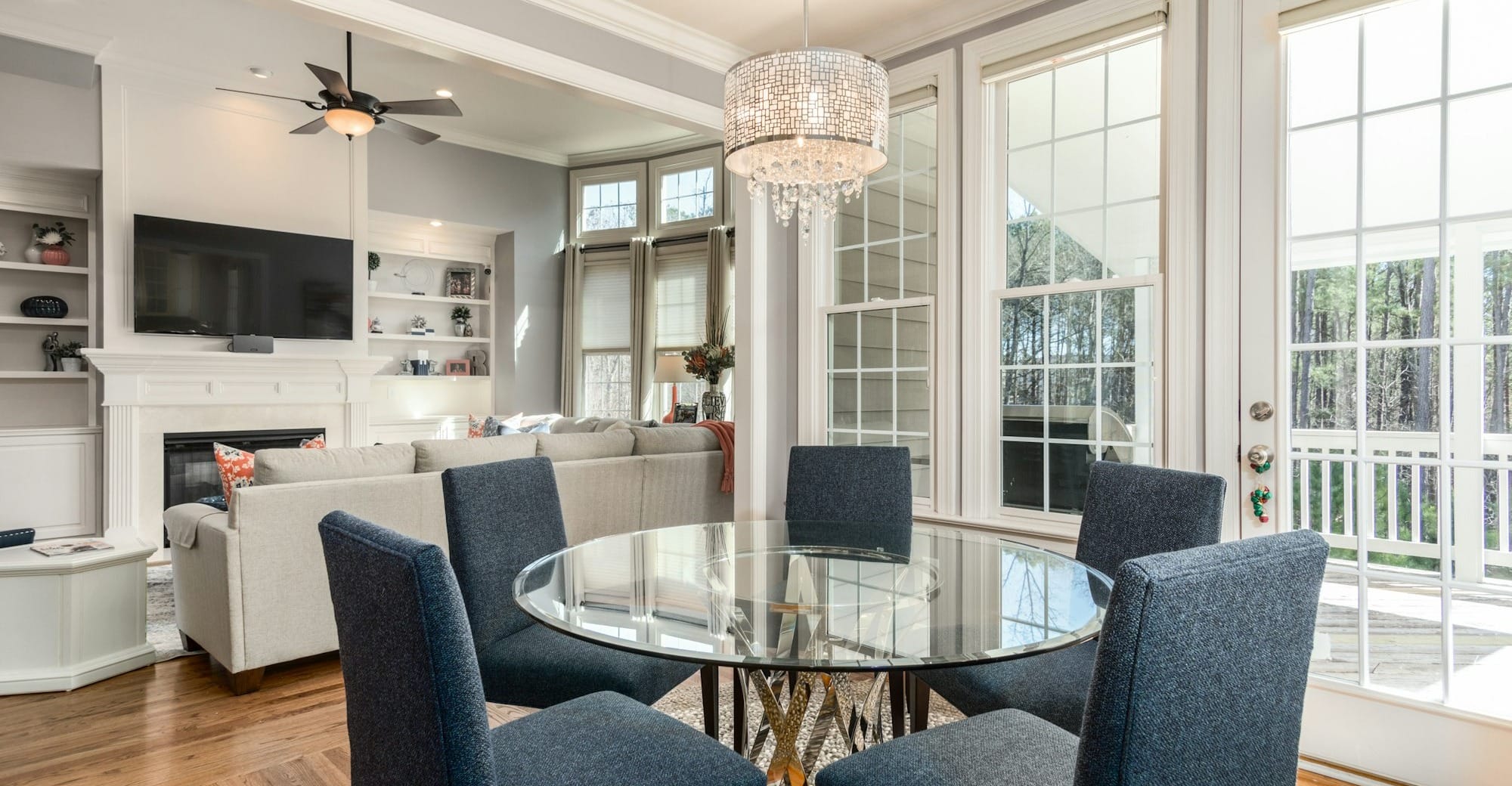 round clear glass-top table and five gray chairs dining se