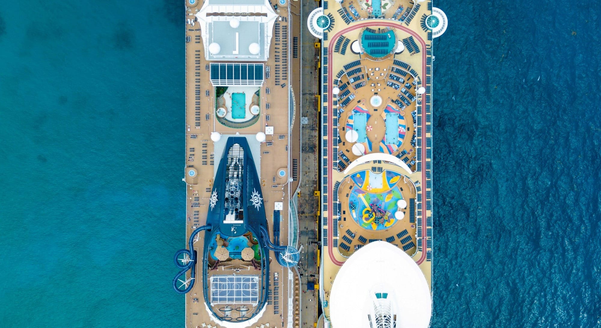 two brown cruise ships on body of water