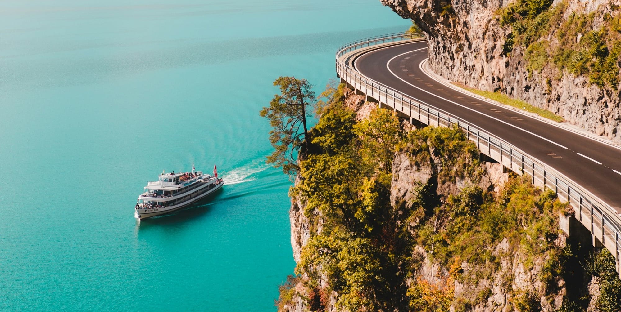 yacht sailing near island during daytime