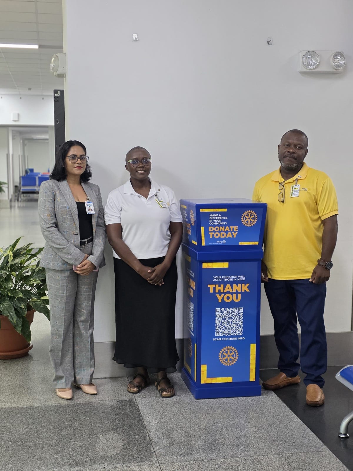 From left: Dacia Samaroo, Commercial Manager at Cheddi Jagan International Airport, who accepted the box on the airport's behalf, with Michelle Howard and Keon Howard of the Rotary Club of Georgetown Central