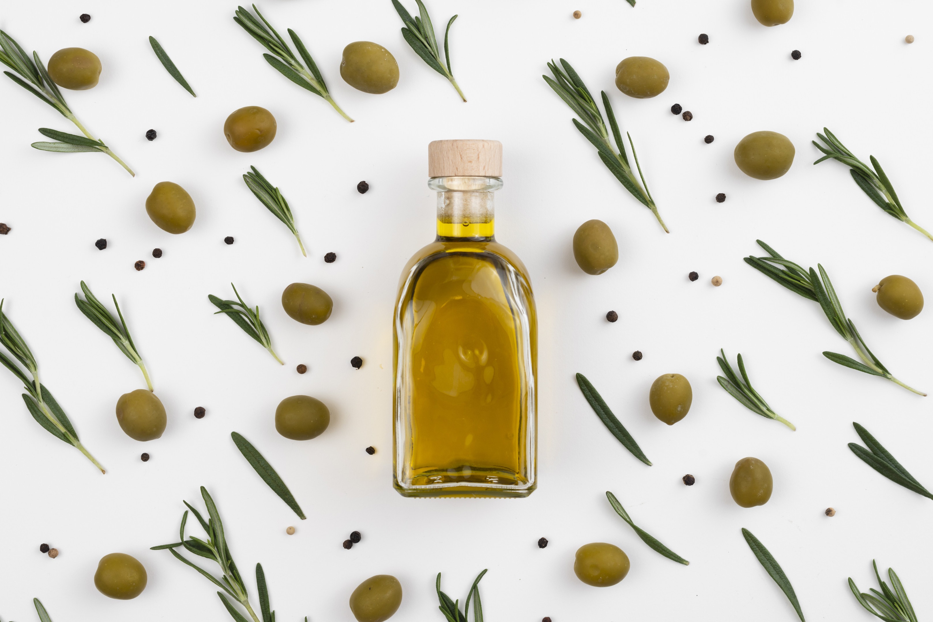 Olives, olive leaves and olive oil bottle