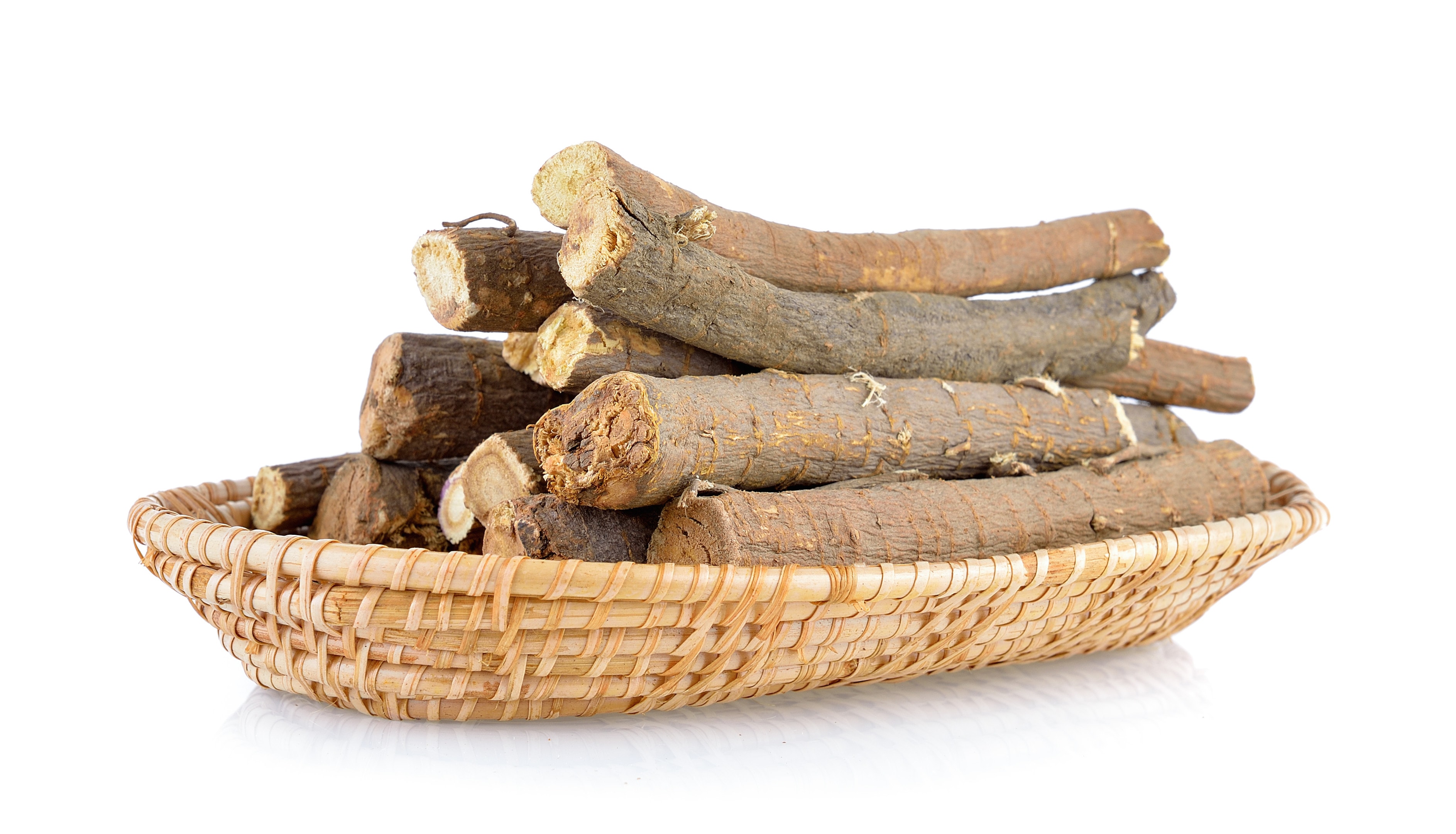 Ashwagandha roots in basket on white background