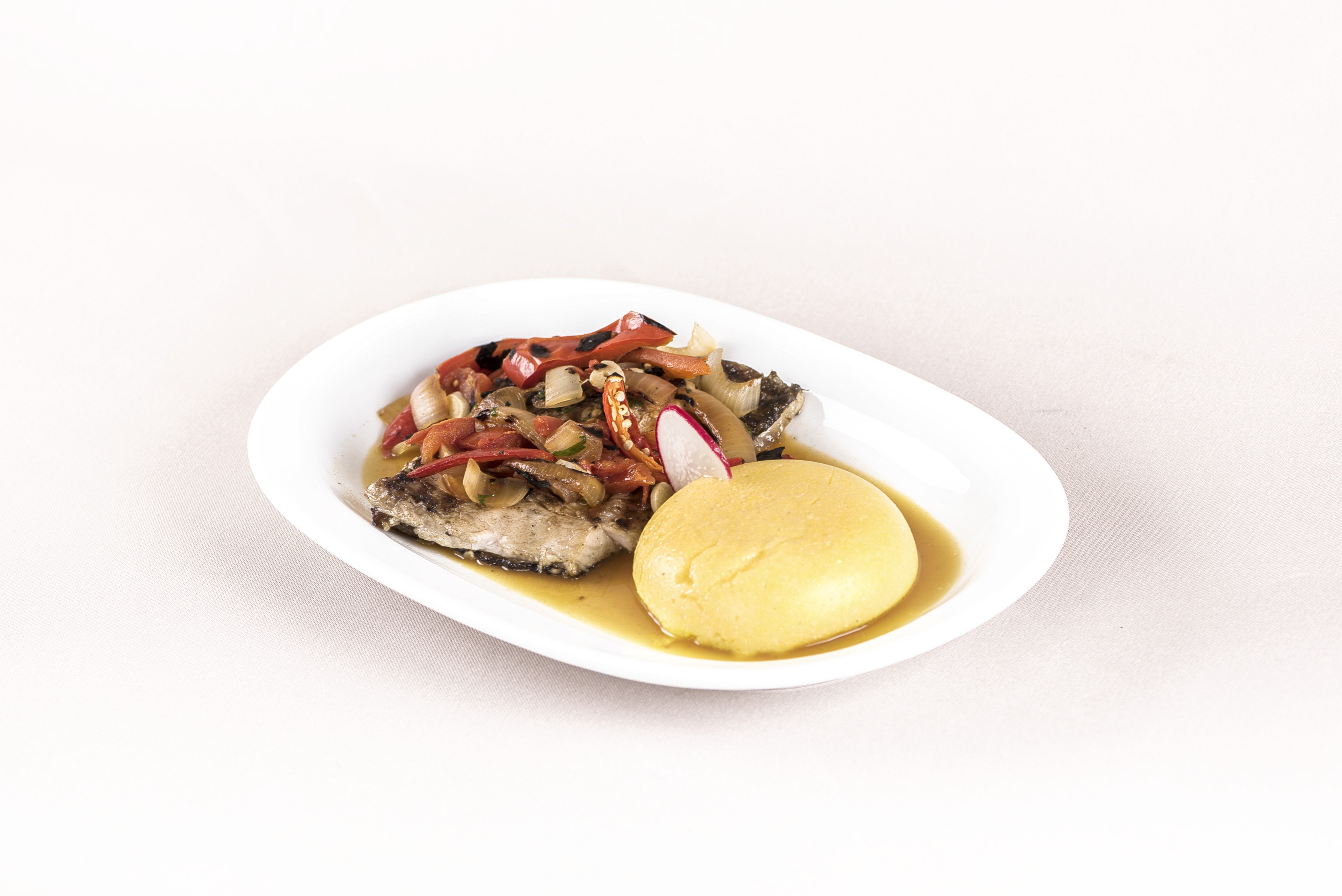 Caribbean coucou and flying fish on white plate