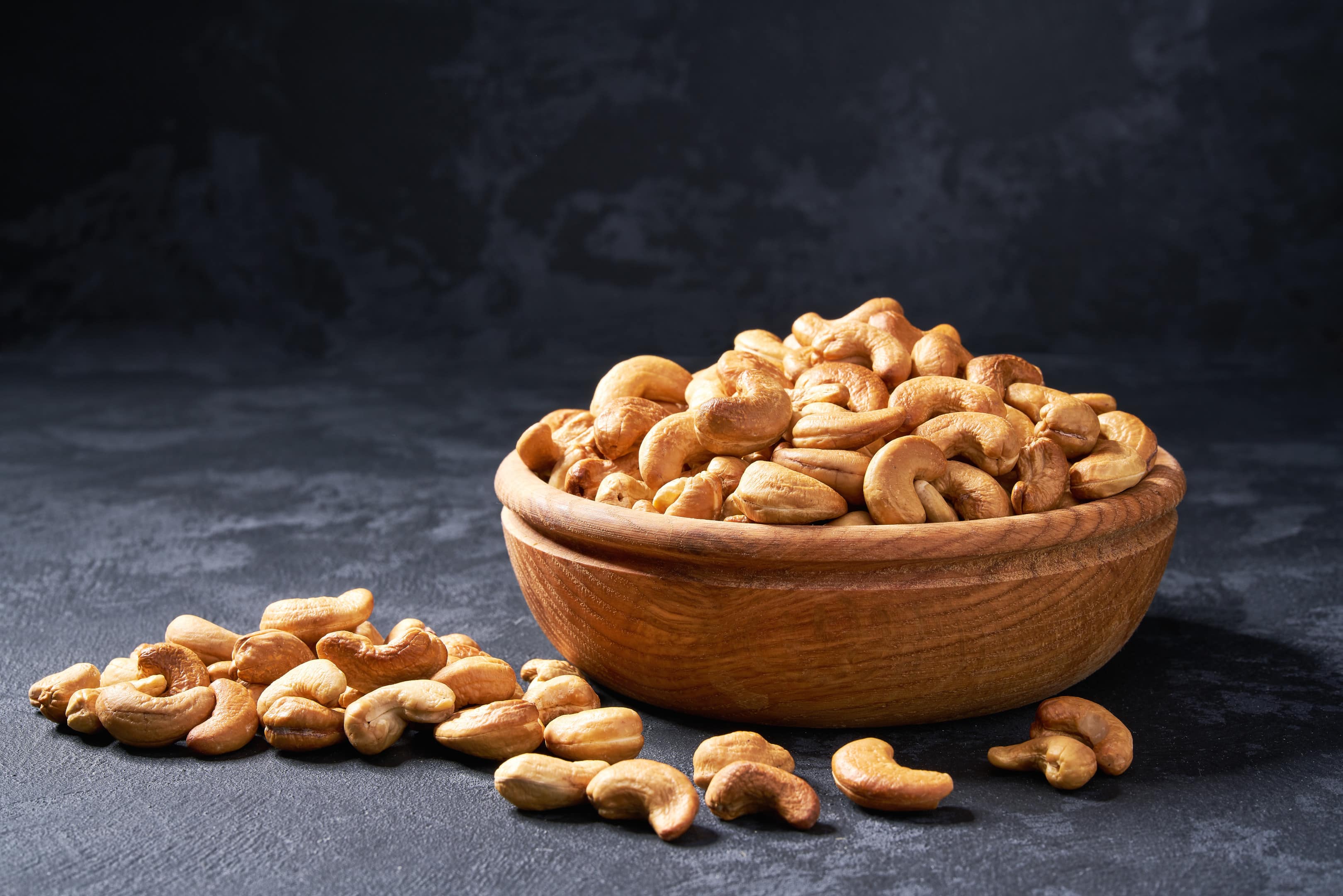 Cashew nuts in wooden bowl