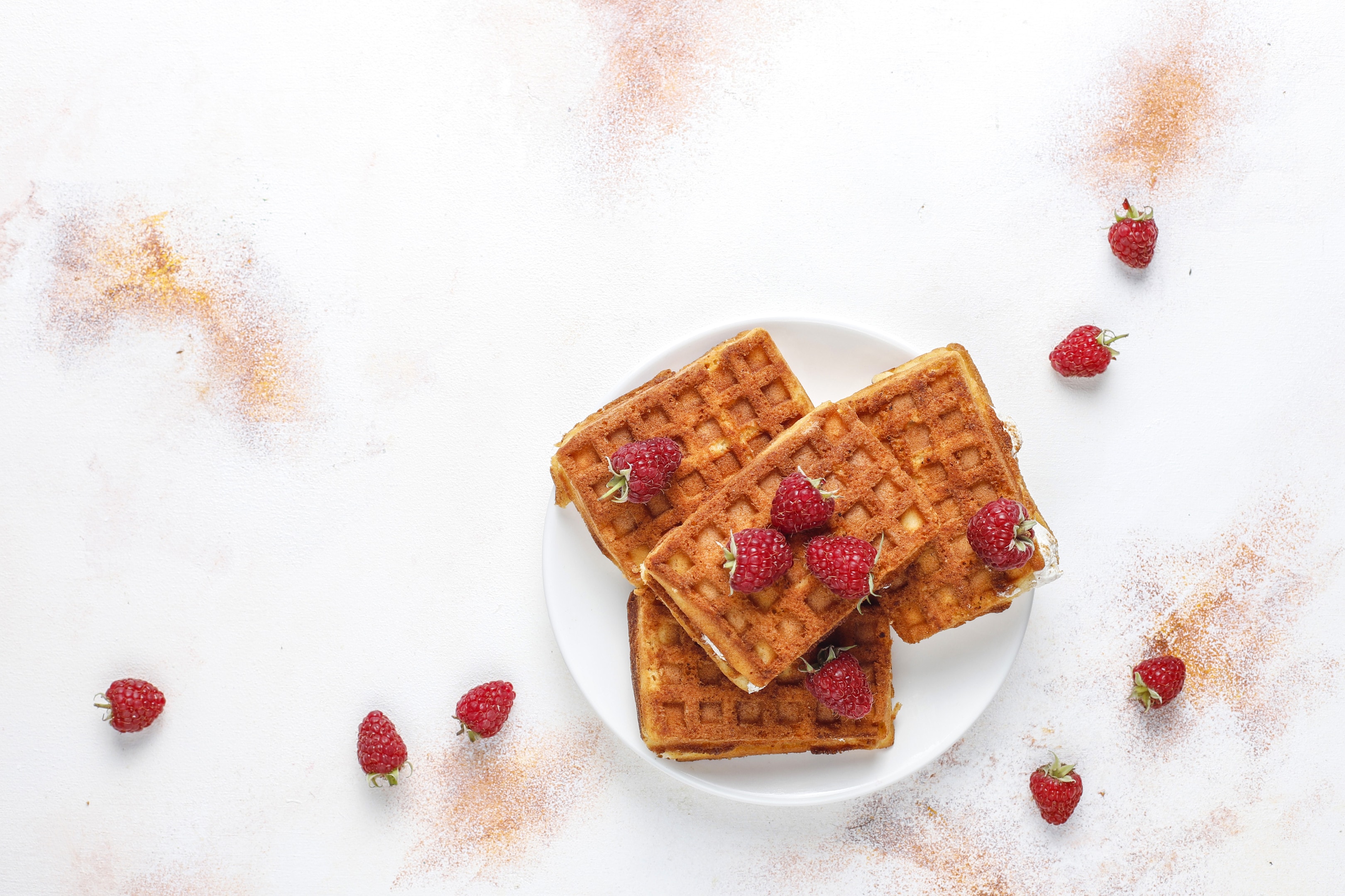 Cassava flour belgian waffles with cream fresh and raspberries