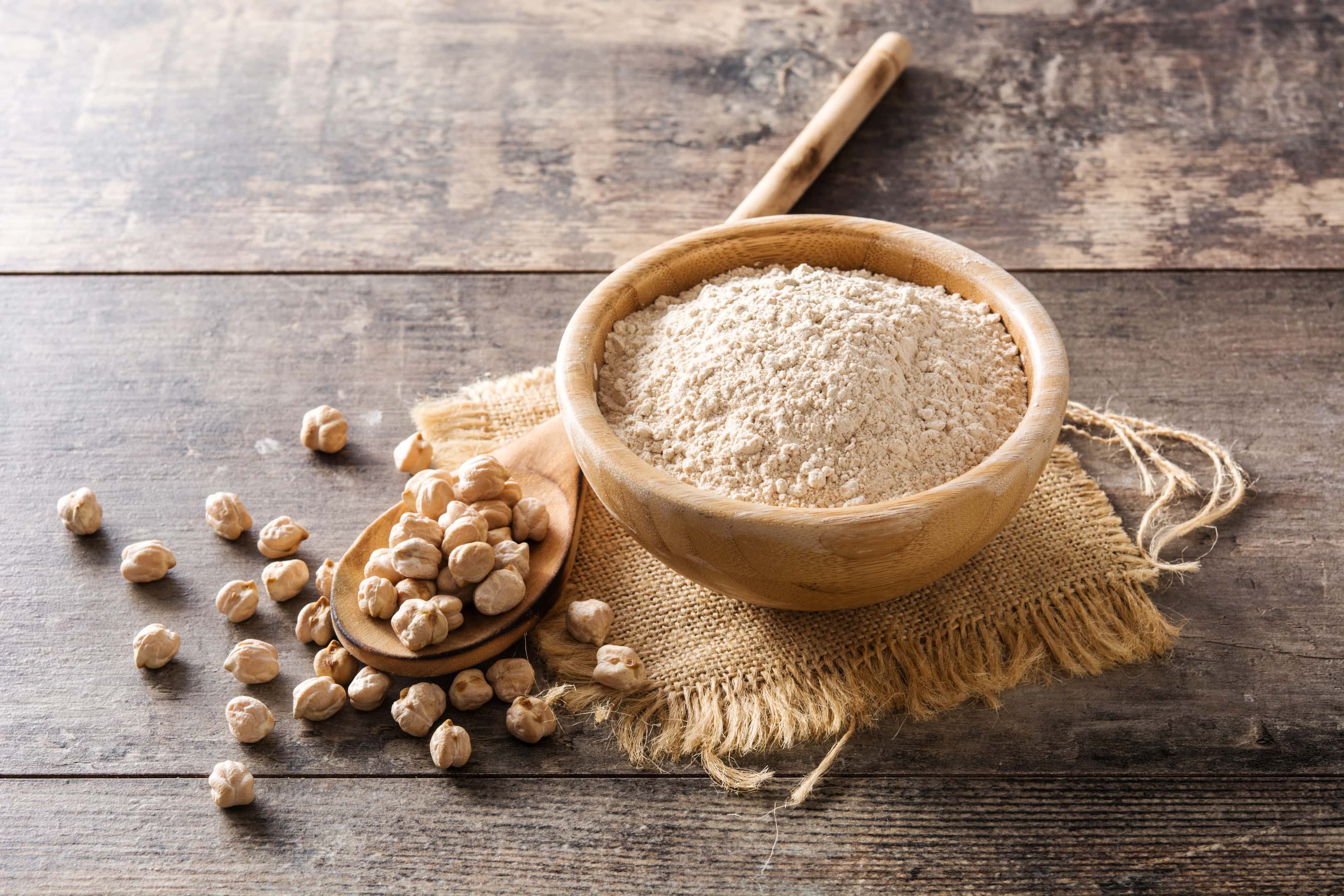 Chickpea flour in a wooden bowl