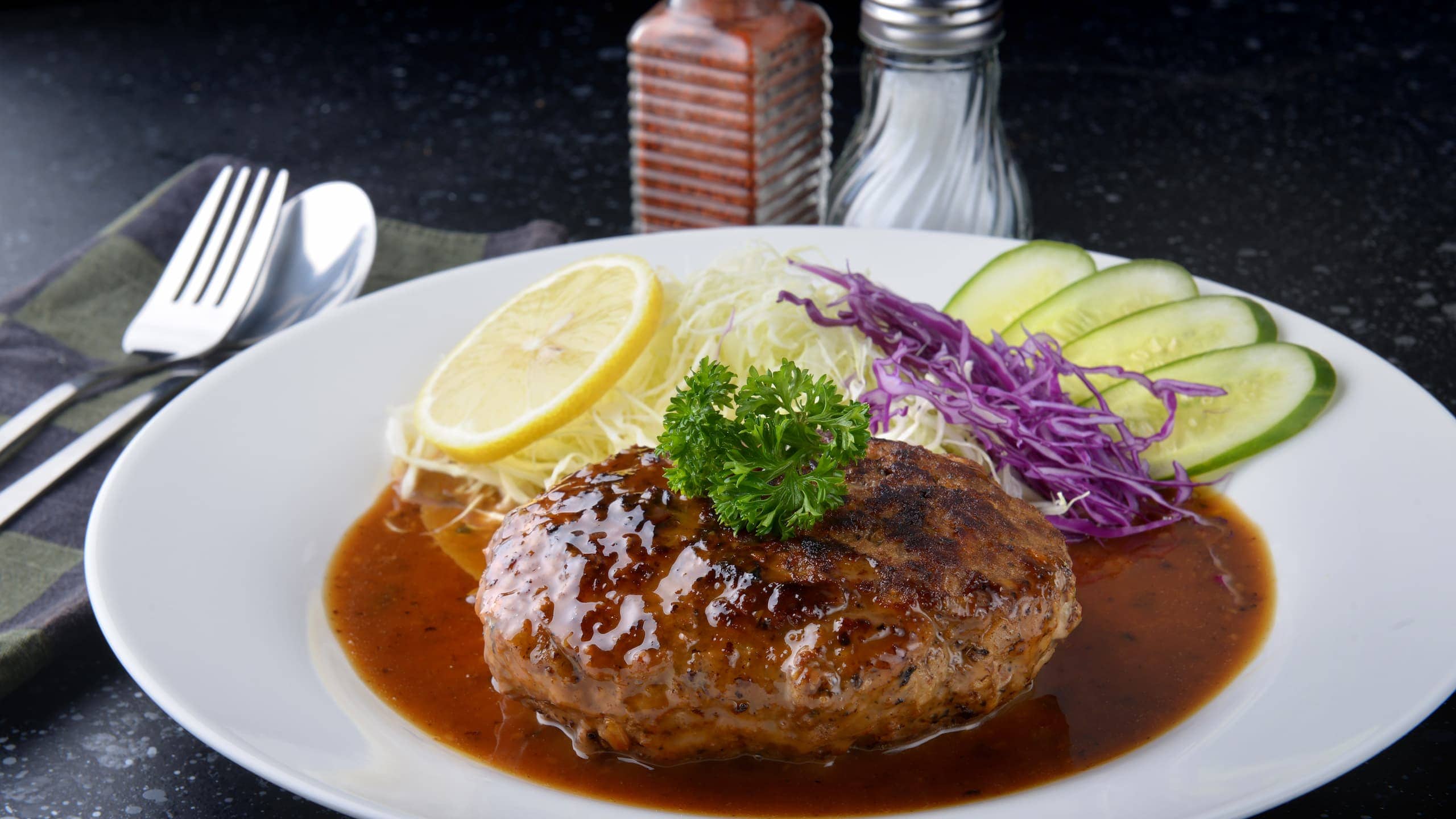 Cracker Barrel hamburger steak served with gravy sauce and veggies