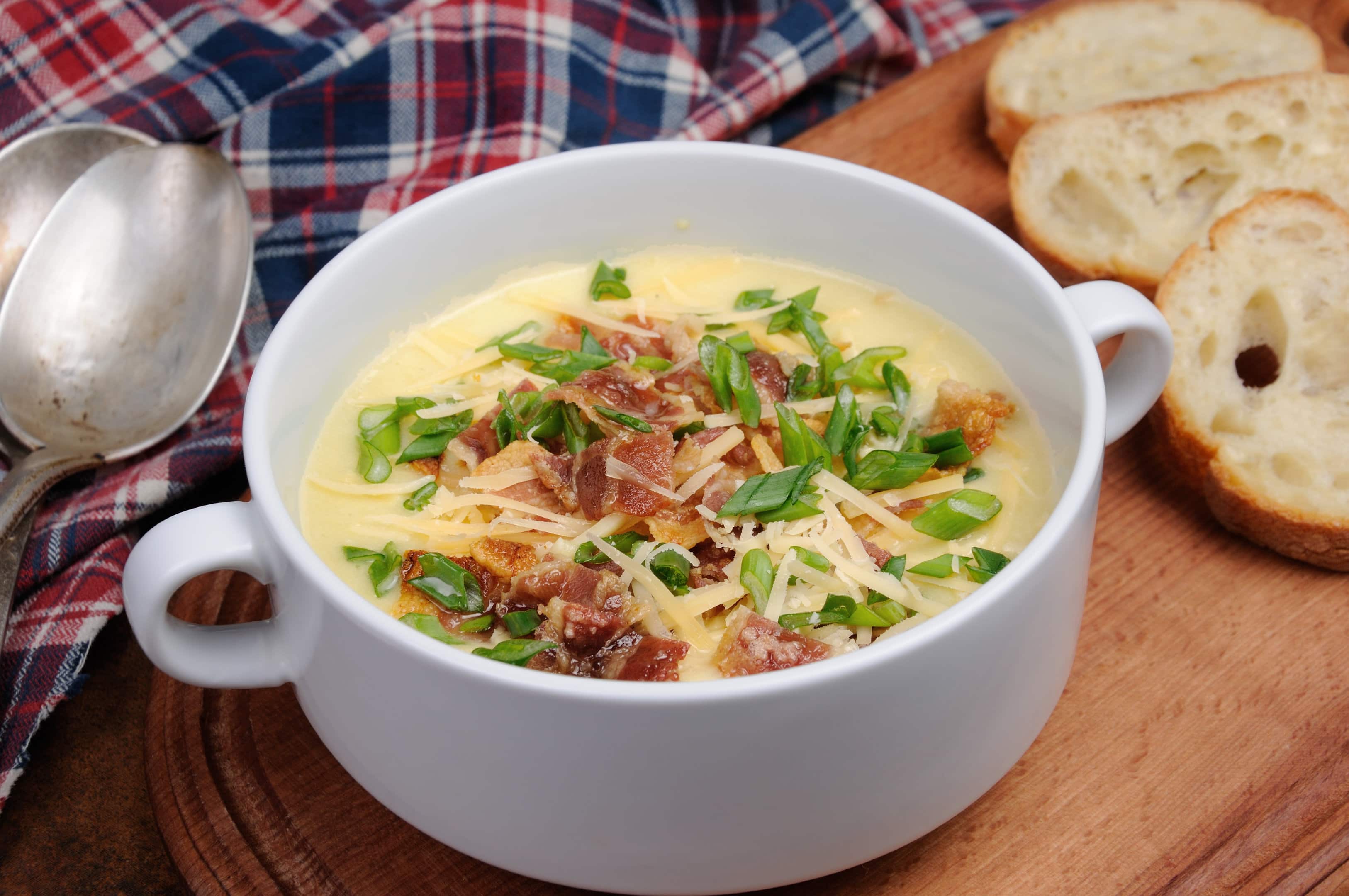 Creamy O'Charley's potato soup with bacon, cheese, and green onions