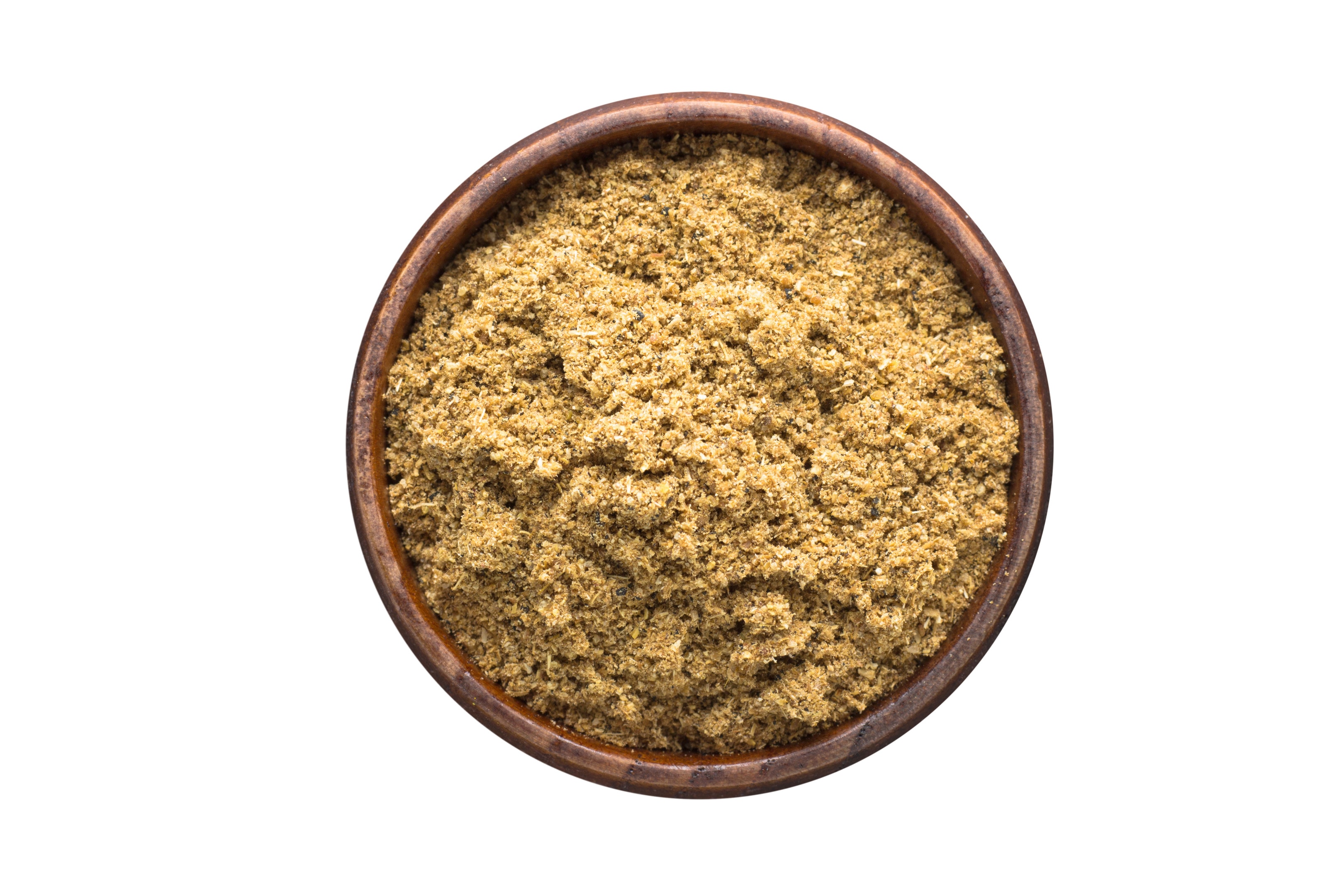 Cumin powder in wooden bowl
