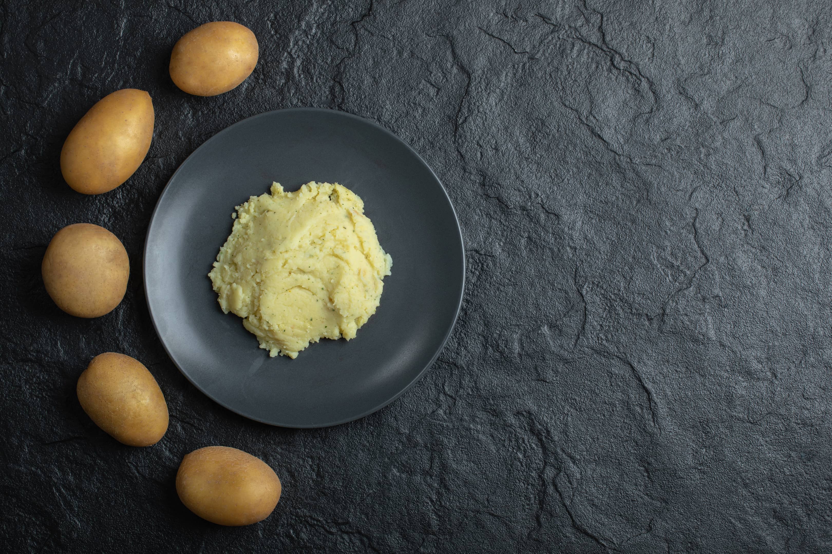 Fresh potatoes and mashed potatoes