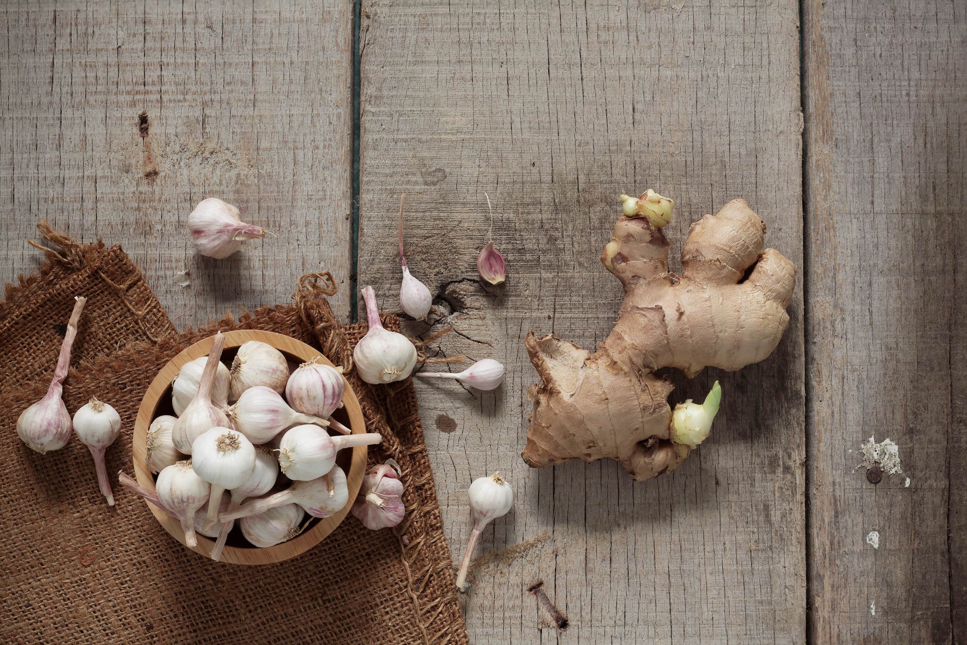 Garlic and ginger on wooden table