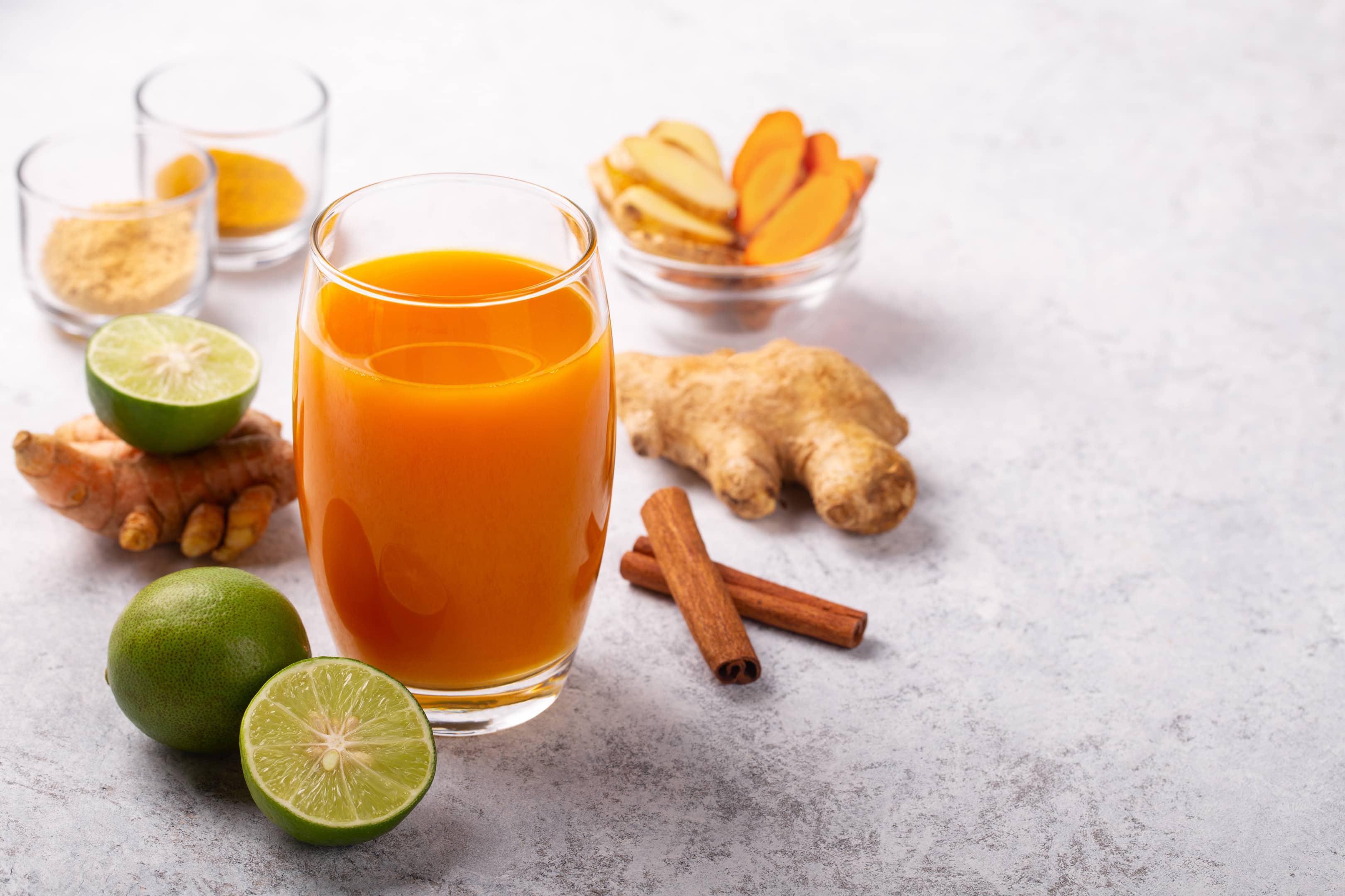 Healthy turmeric, tamarind and ginger drink with lime