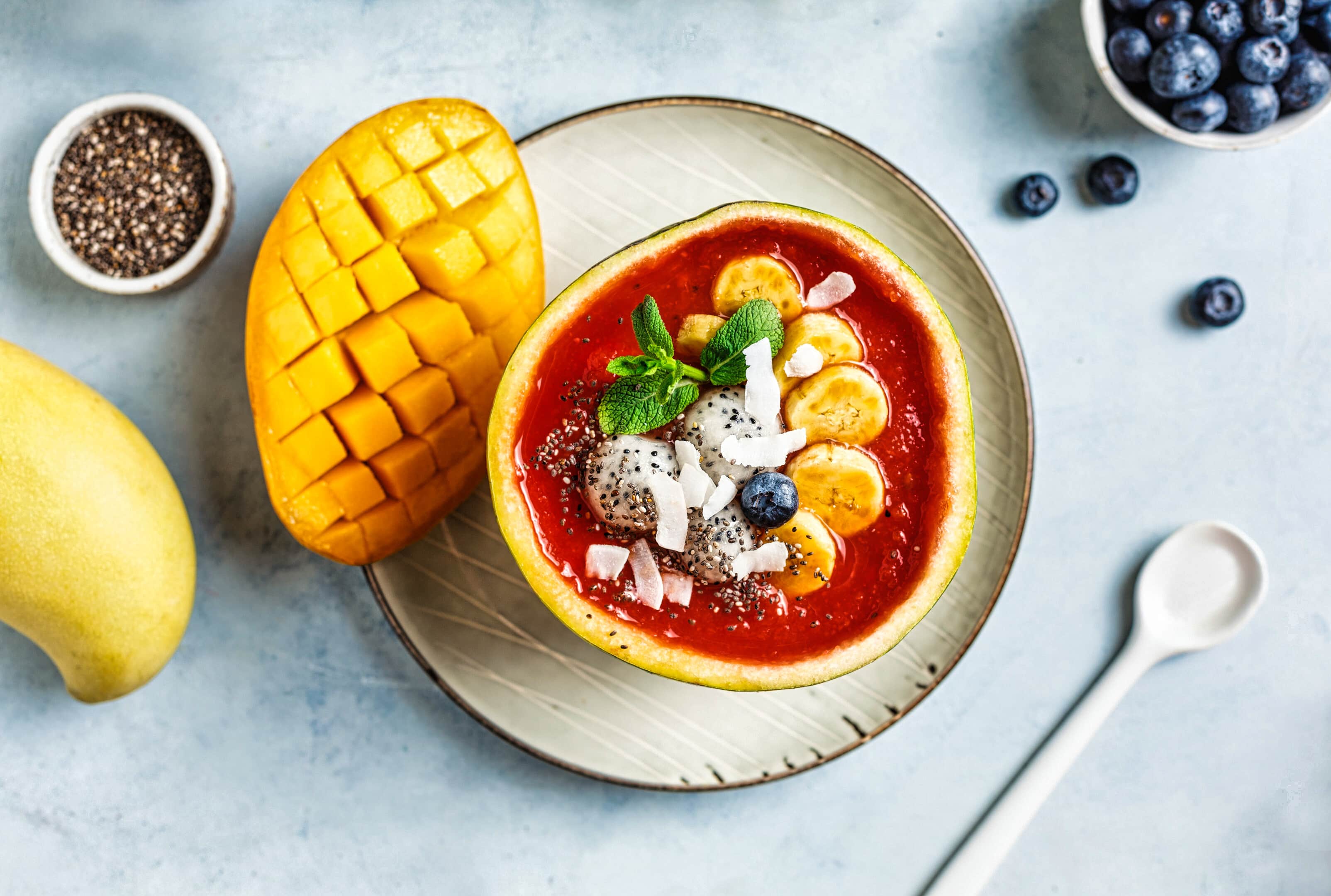 Healthy watermelon smoothie with mango, dragon fruit and pineapple