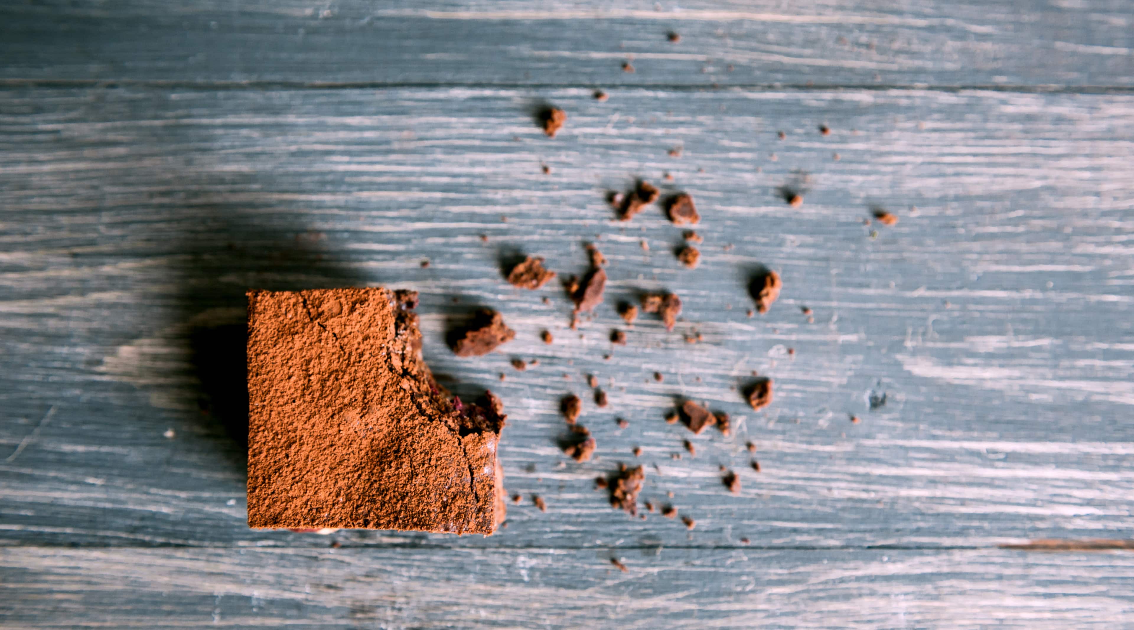 Homemade chocolate chickpea brownie vegan and gluten-free on a wooden table