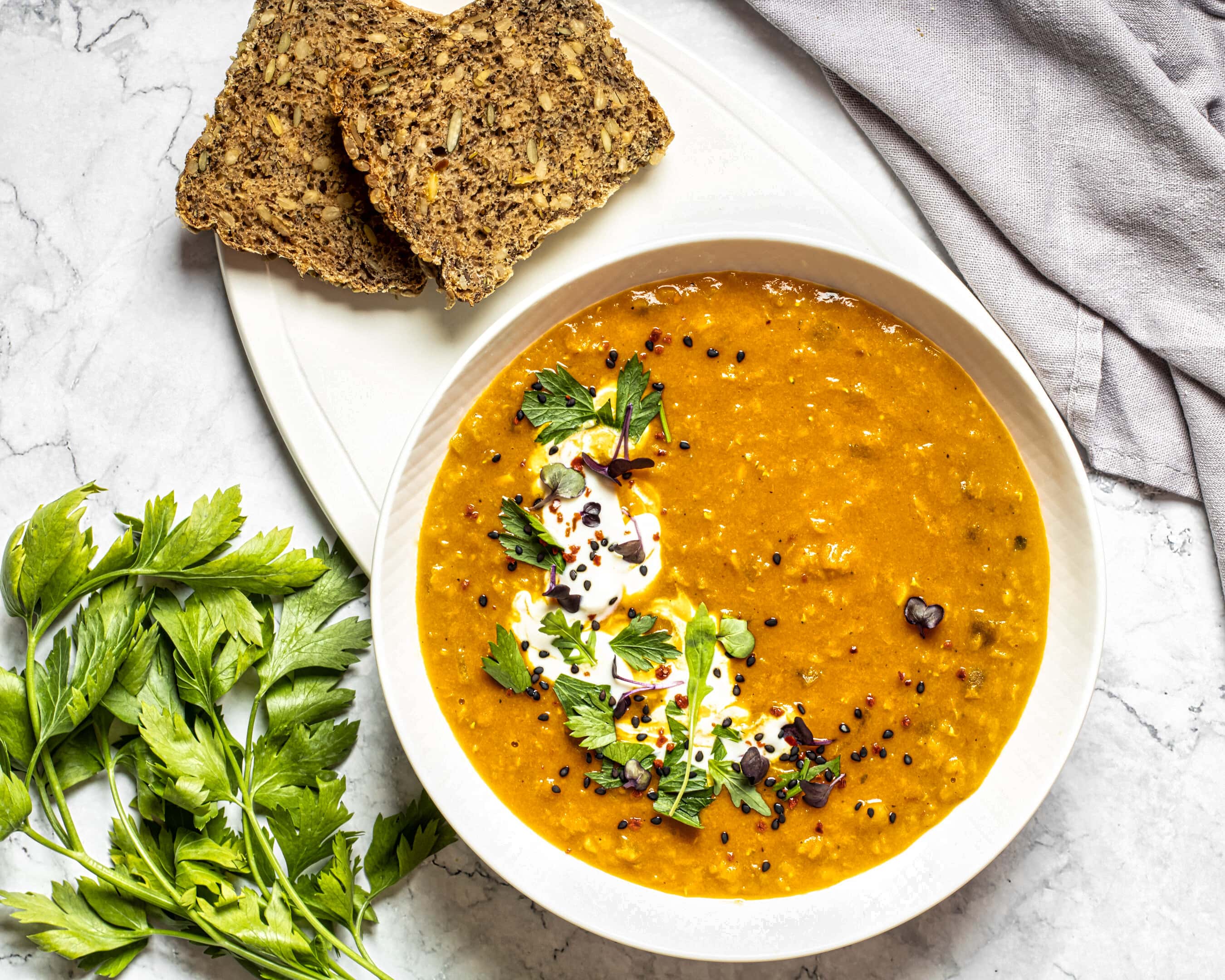 Lentil soup with whole grain bread slices