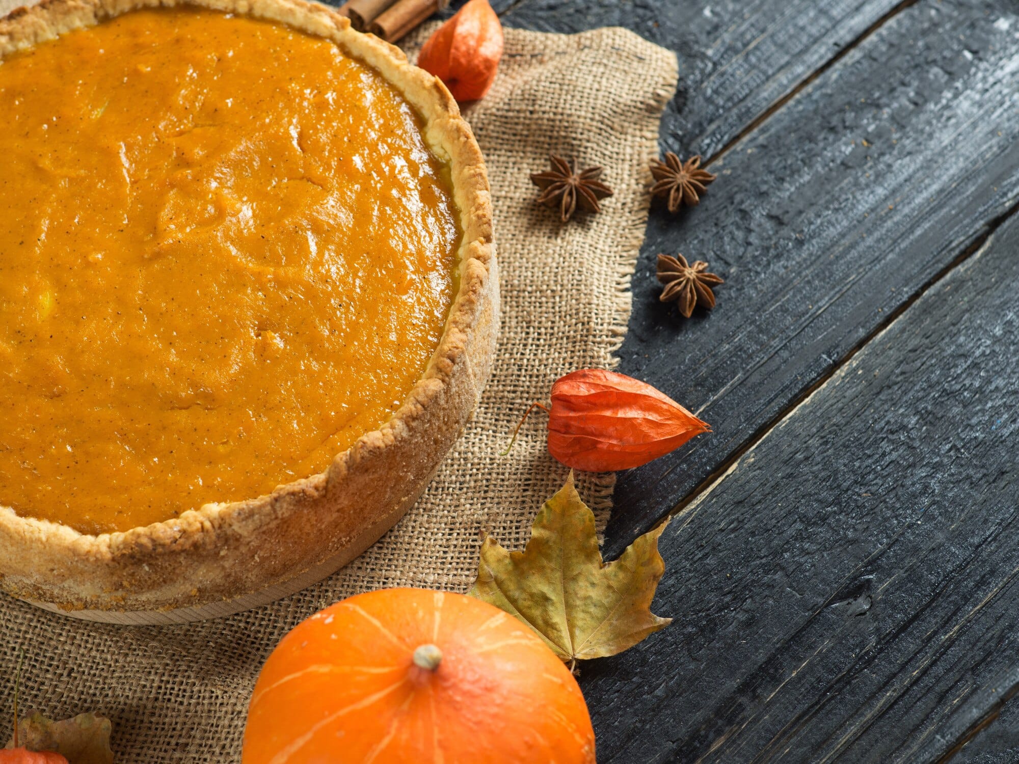 Pumpkin pie with autumn spices and decor