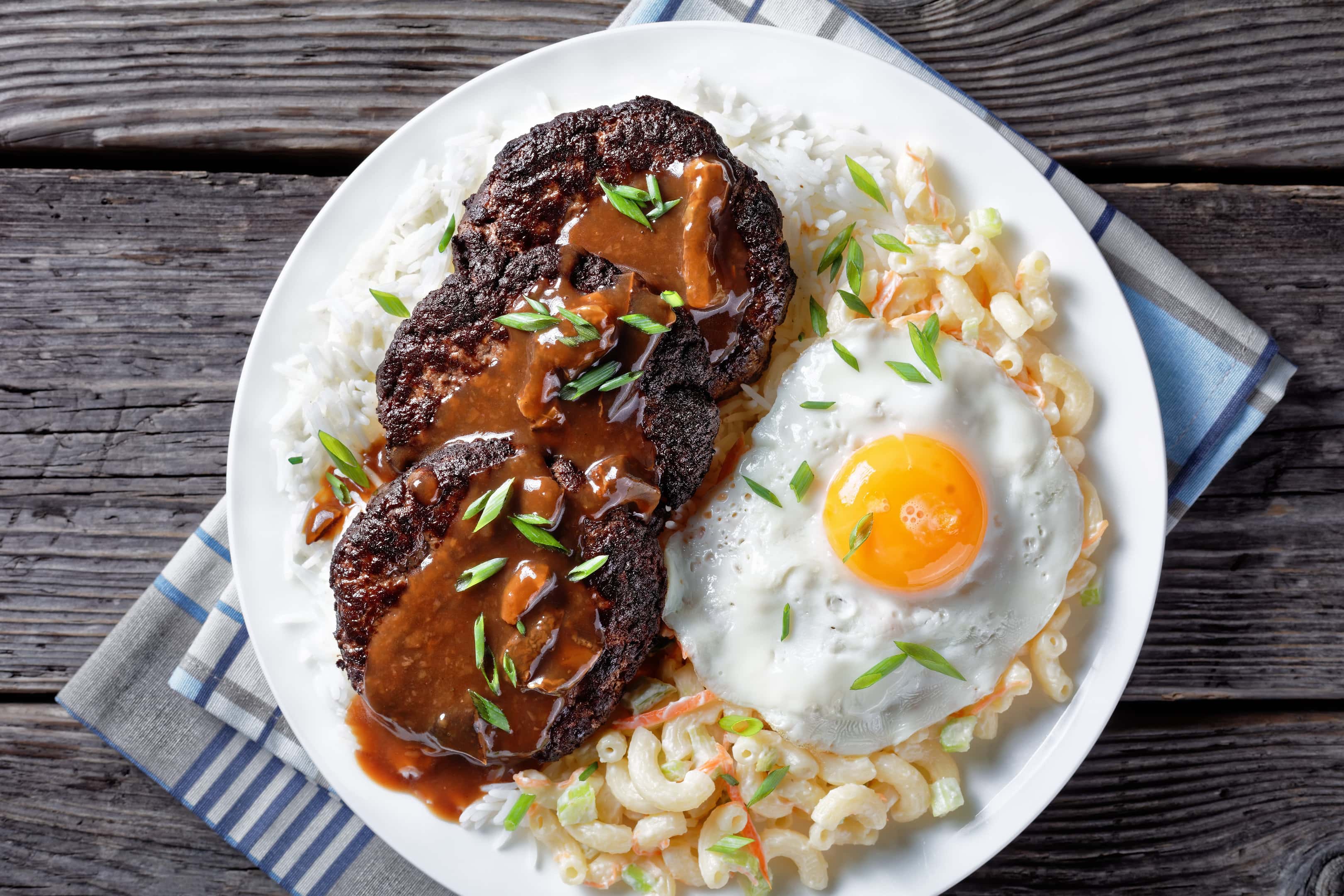 Loco moco — hamburger patty, rice, fried egg, and gravy