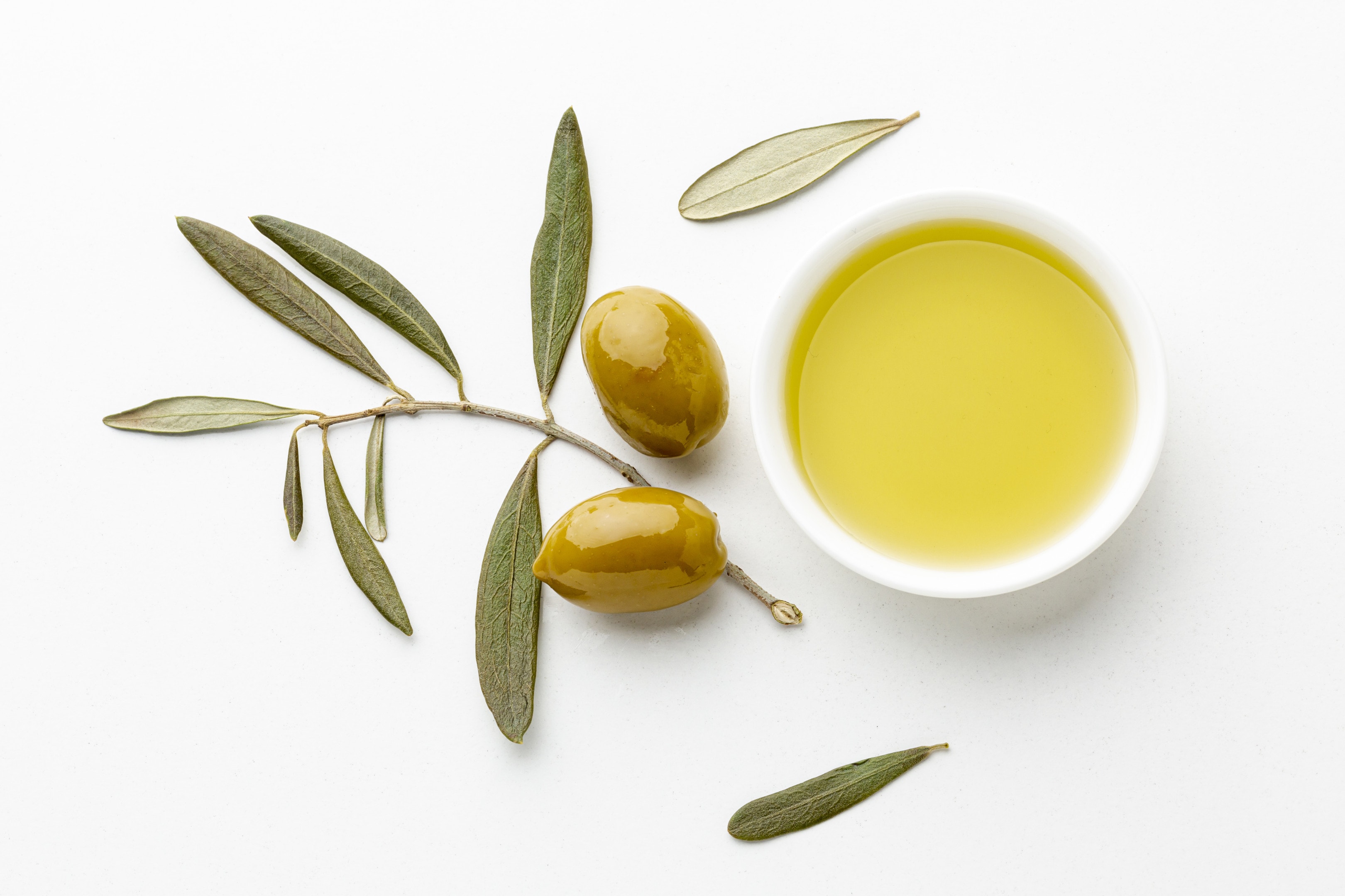 Olive Oil With Olive Tree Leaves and Yellow Olives