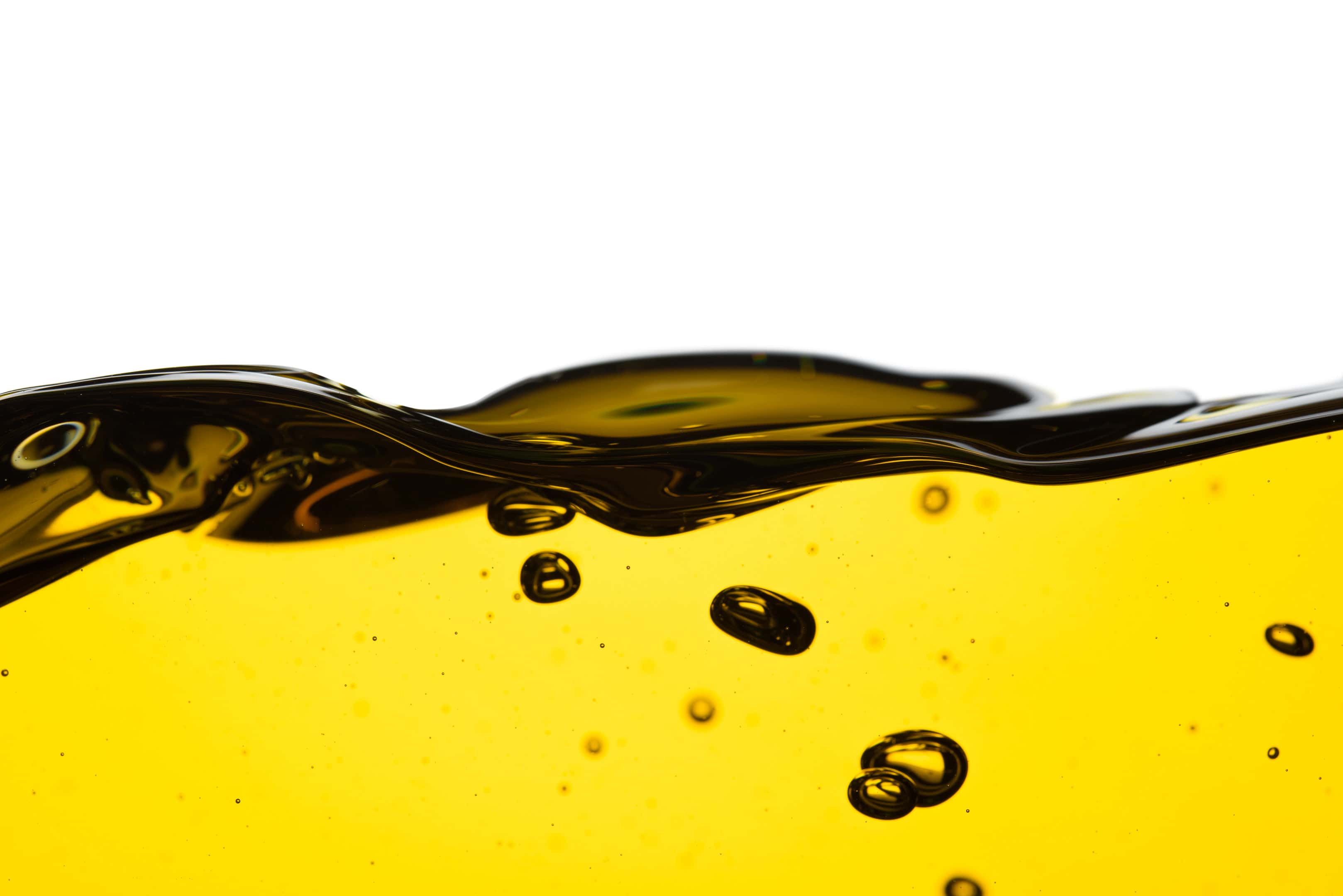 Pouring vegetable cooking oil isolated white background