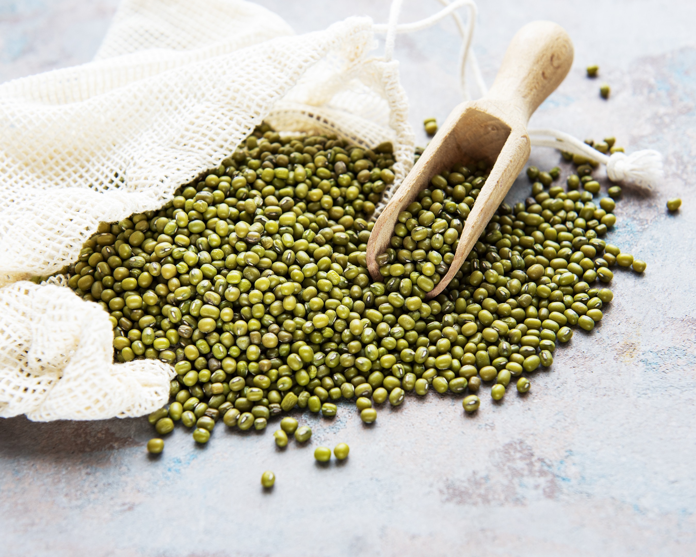 Raw mung beans (green grams) in a cotton bag