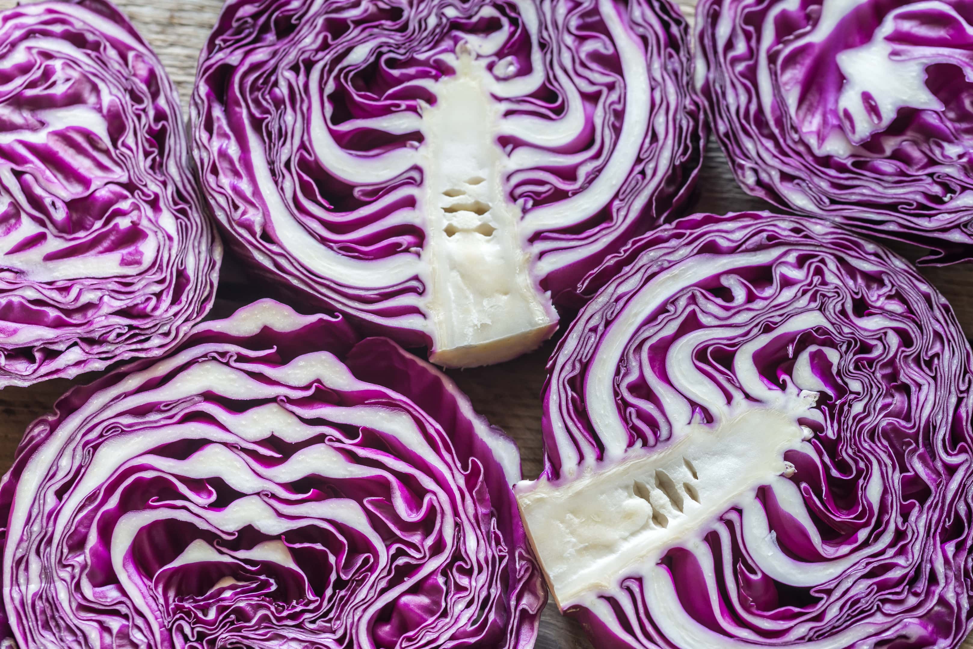 Red cabbages on the wooden background