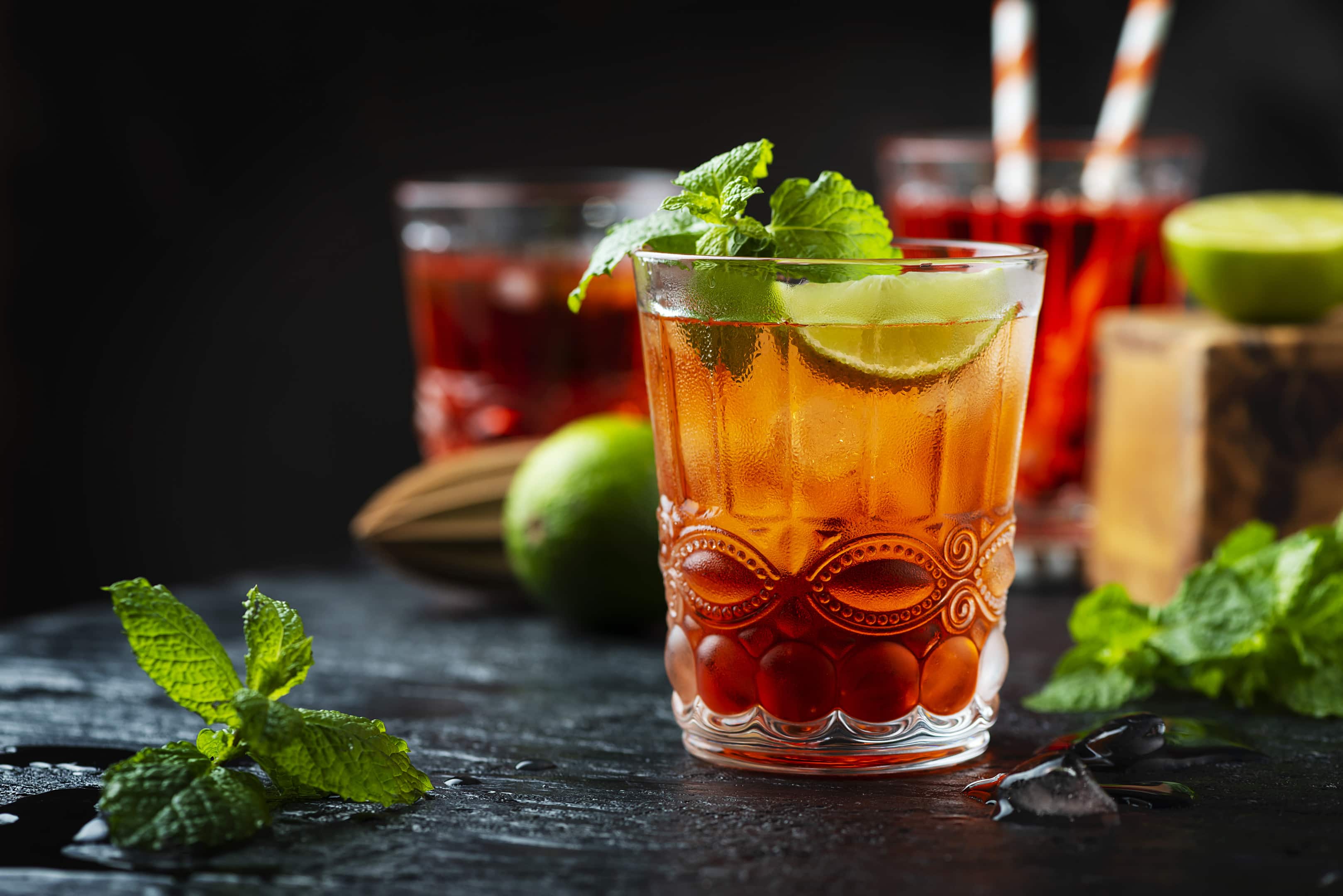 Red fresh cocktail with ice and lime