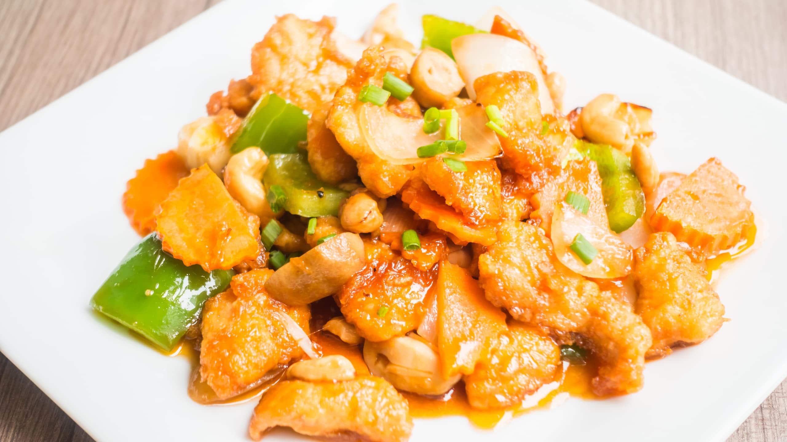 Sweet and sour chicken Jamaican style with cashew nuts