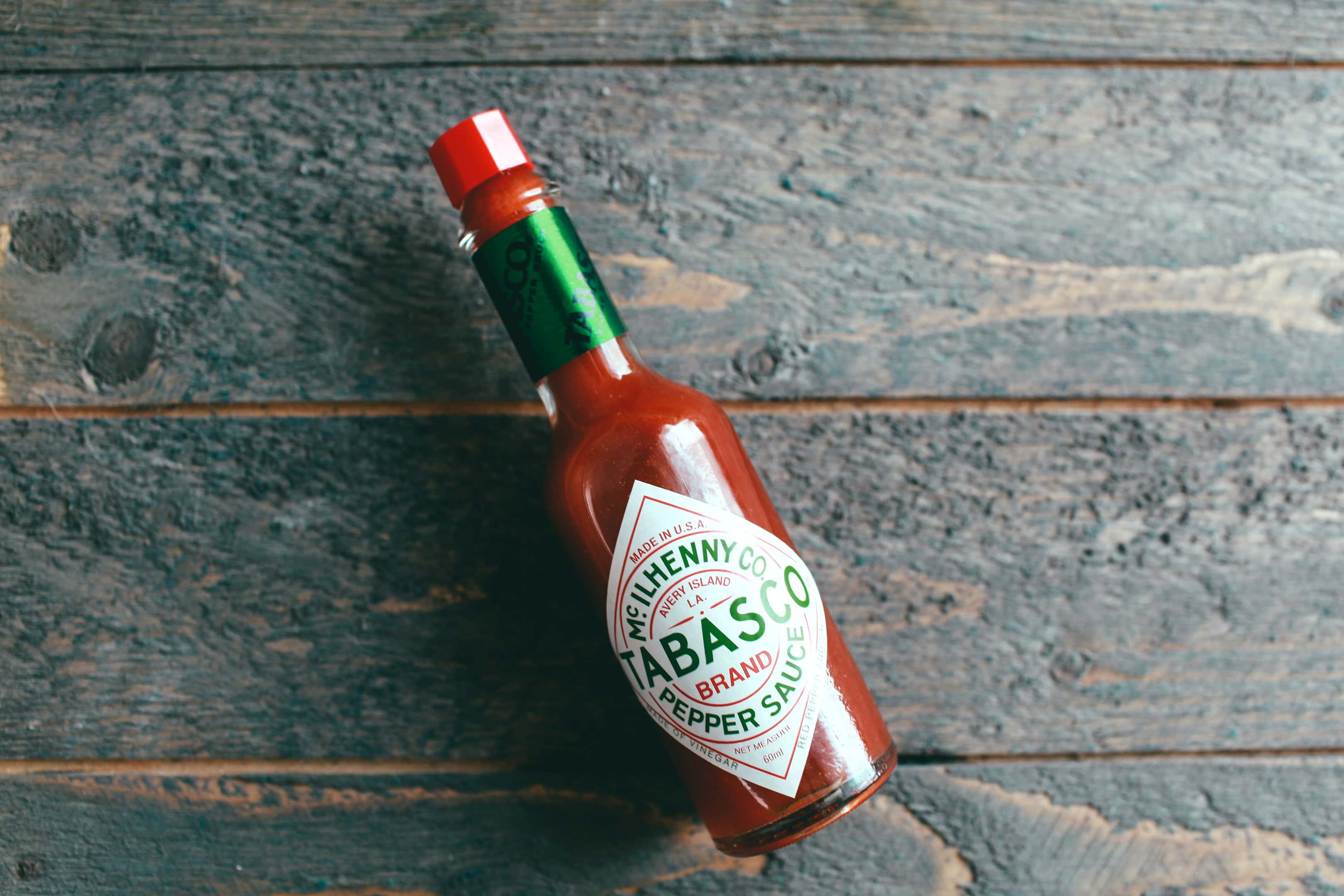 Tabasco hot sauce bottle on a wooden table