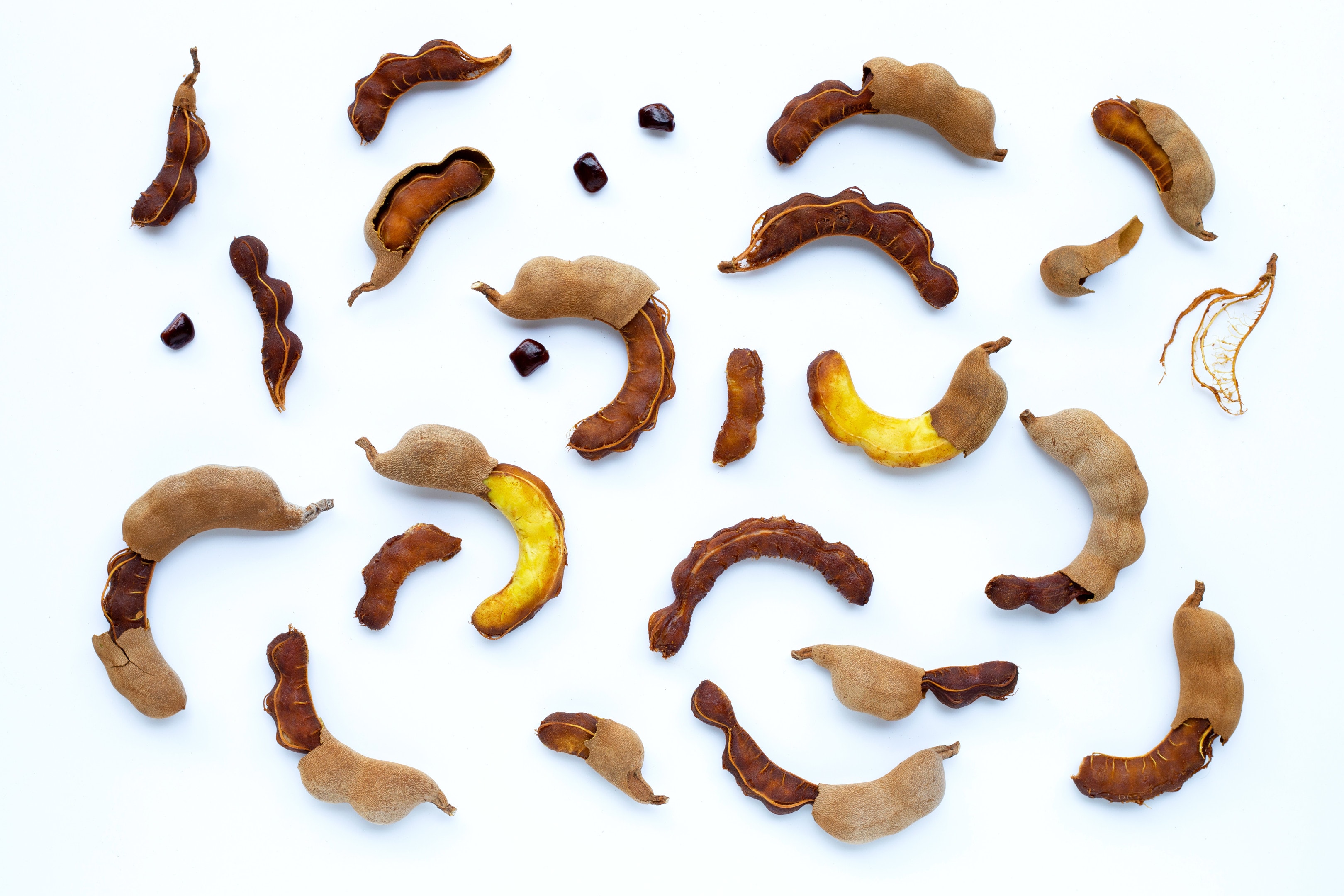 Tamarind tropical fruit on white background