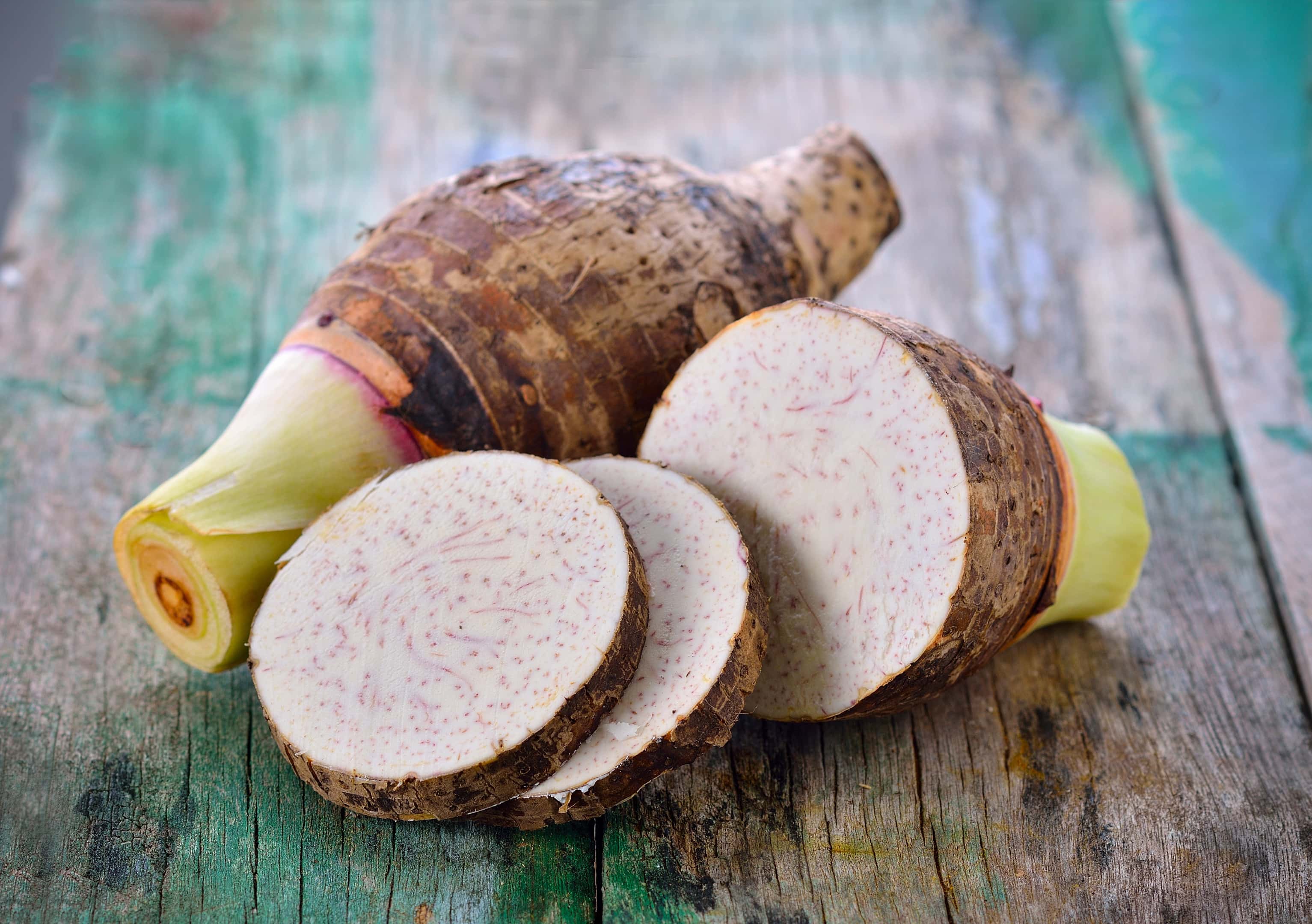 Taro root on wooden table