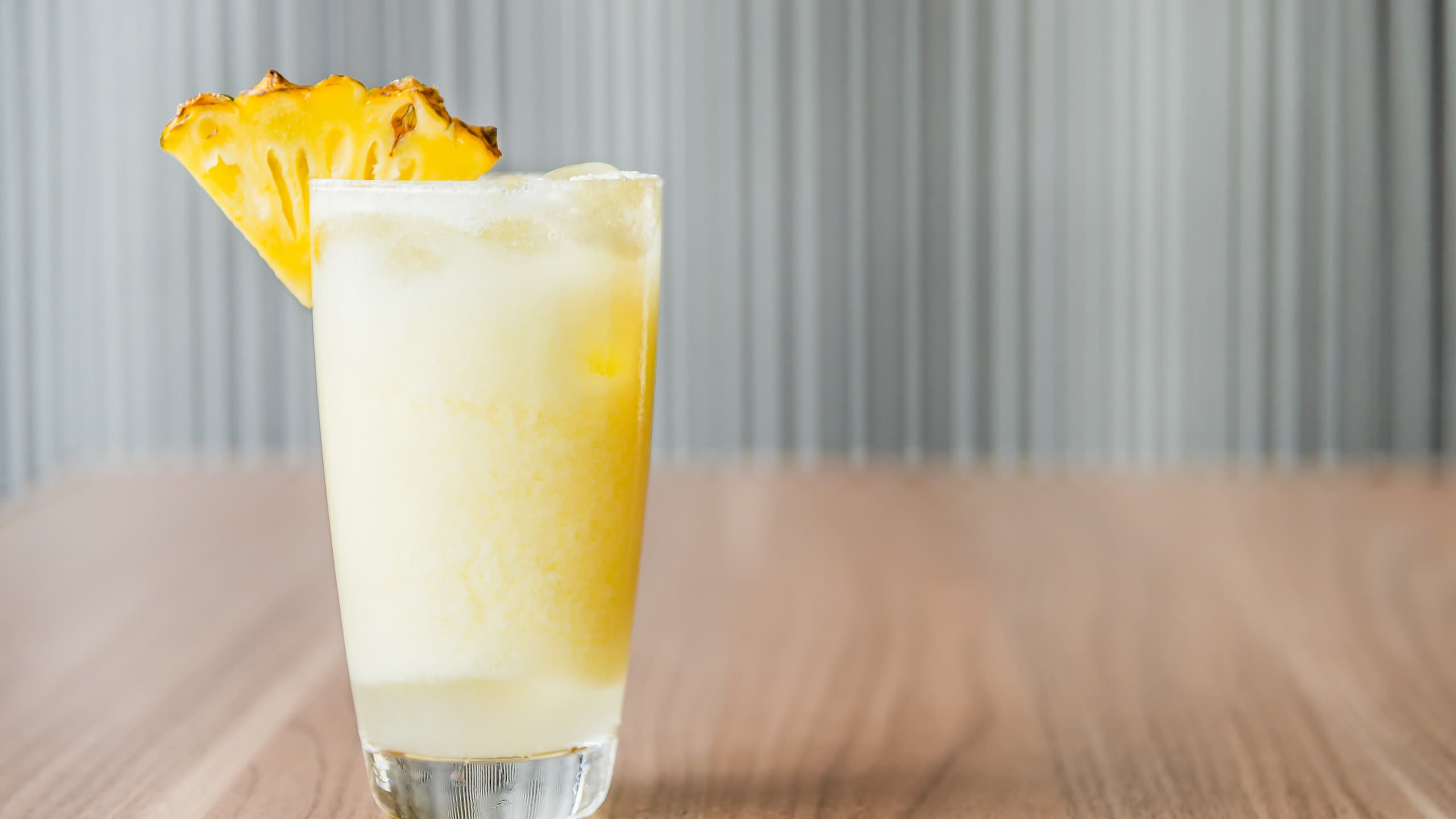 Tasty Soggy Dollar painkiller with pineapple garnish