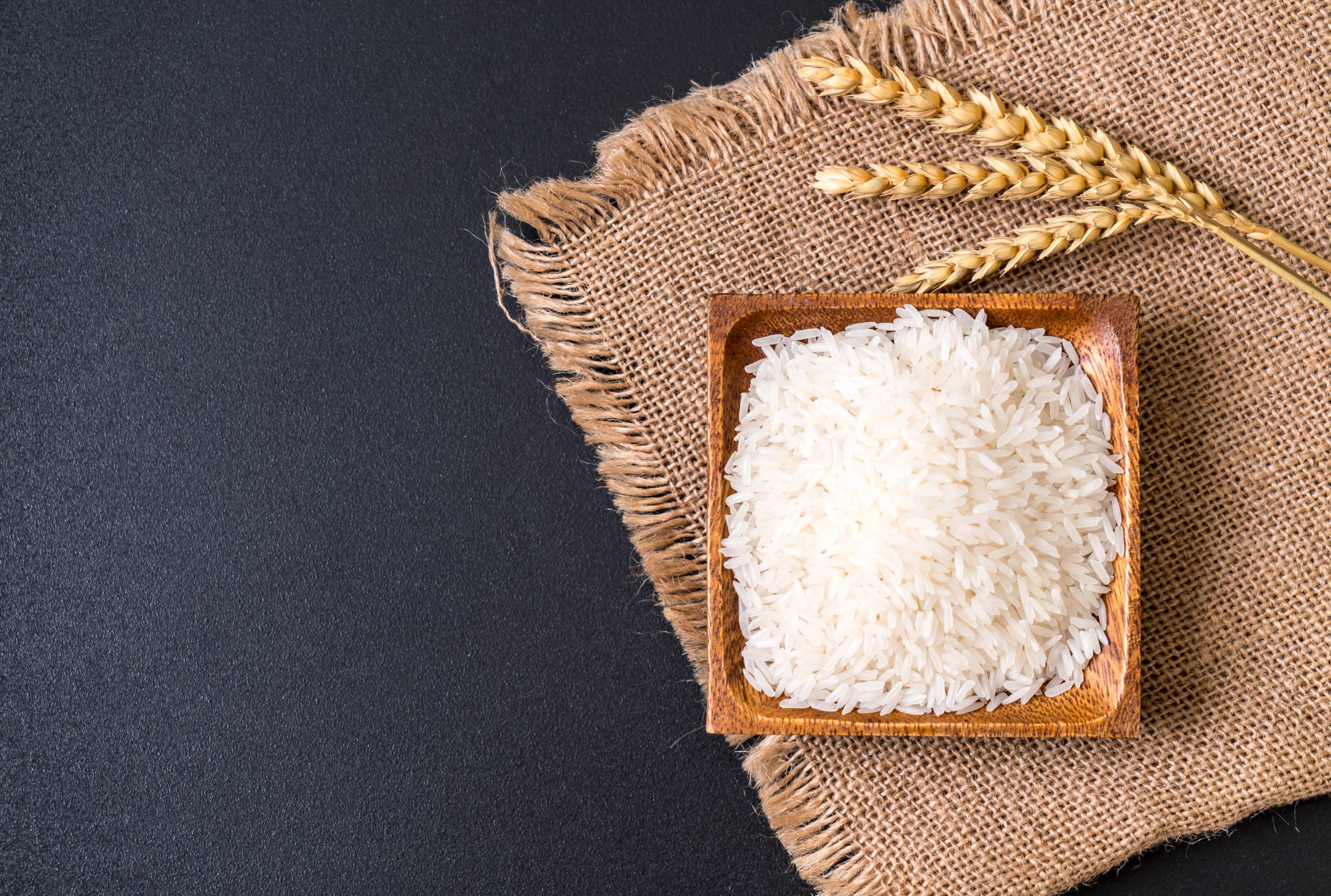 Thai white jasmine rice on wooden plate