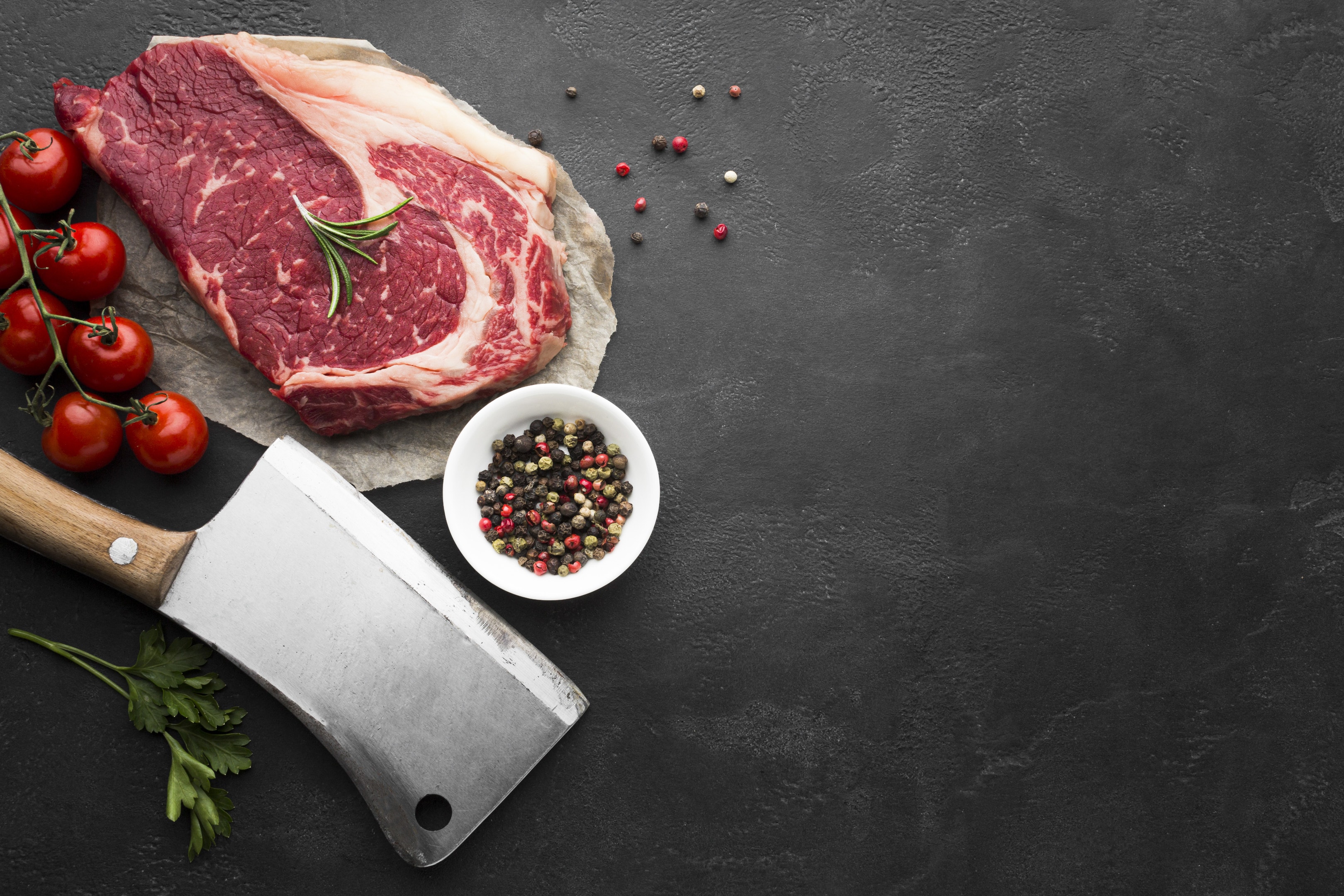 Top view red meat fresh steak on table with tomatoes