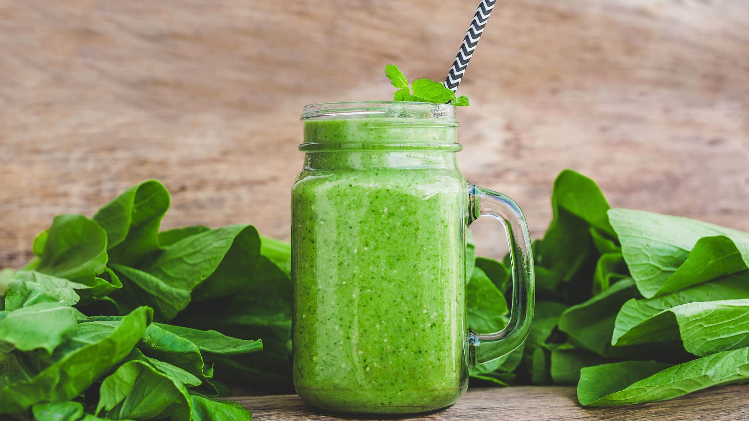 ultimate meal replacement smoothie filled with spinach, banana, and coconut milk