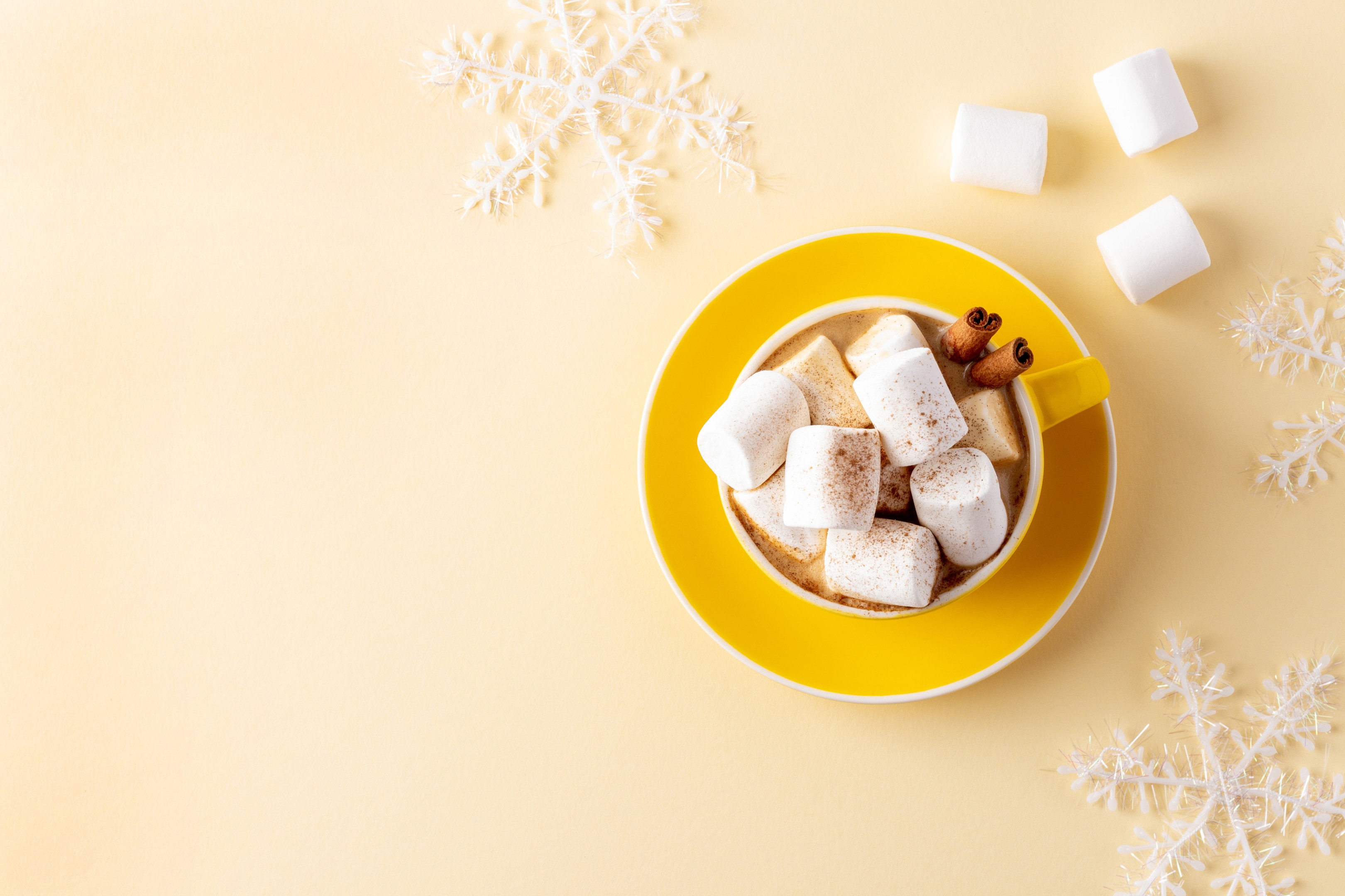 Hot chocolate with marshmallows in a yellow mug
