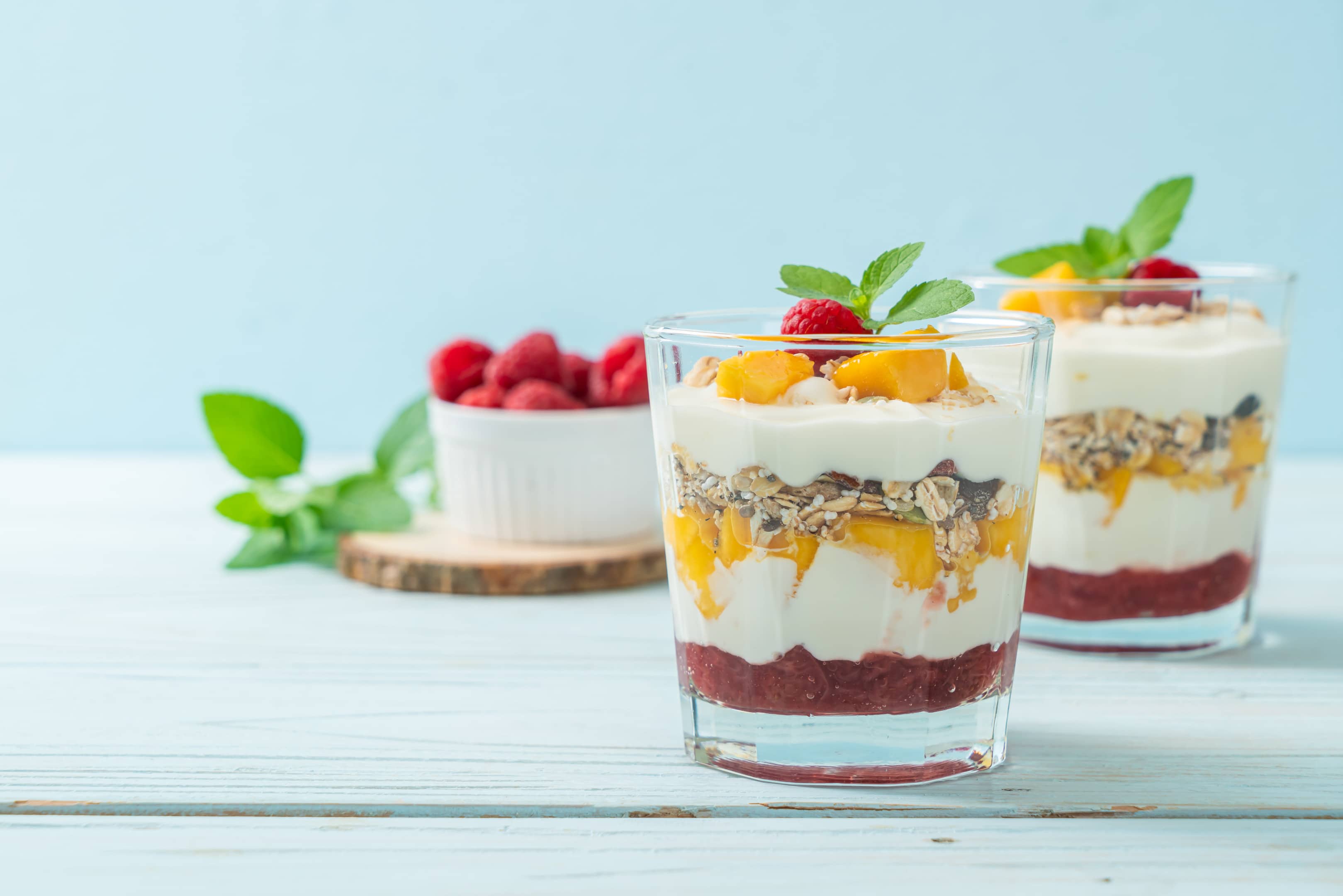Low-fat yogurt granola with fresh apricot, raspberry and cranberries