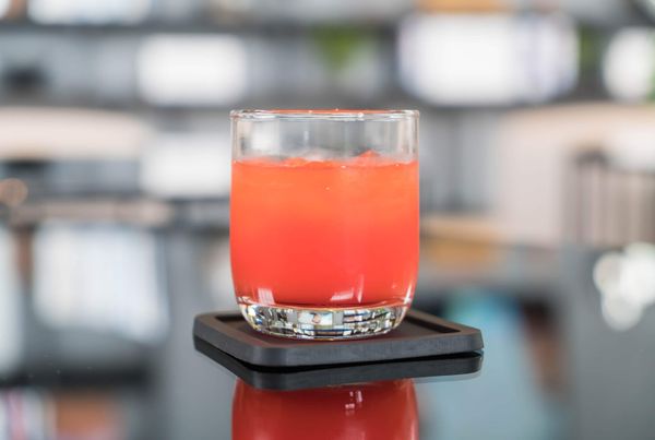 A glass of Hunch Punch cocktail