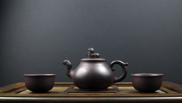Ancient teapot with black soybean tea