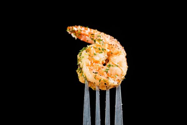 Seasoned shrimp on a fork