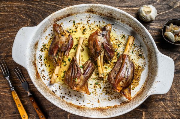 Homemade braised lamb shanks in a baking dish