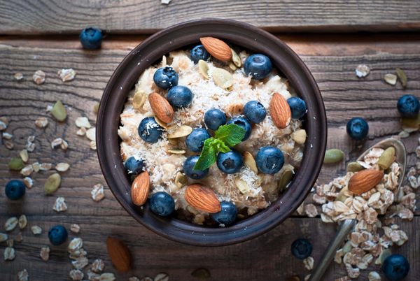 Oatmeal with blueberries, almonds, coconut and pumpkin seeds