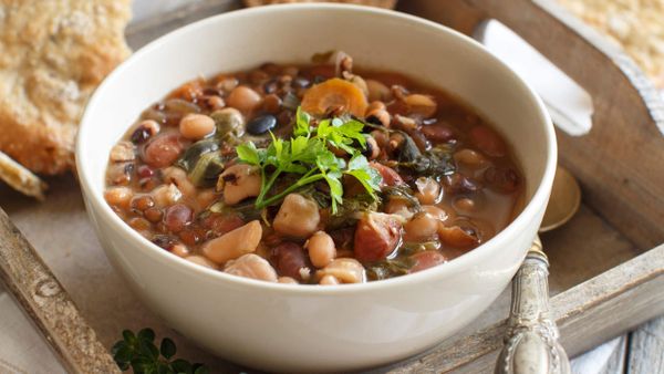 Bowl of Anasazi beans soup with mixed beans and herbs