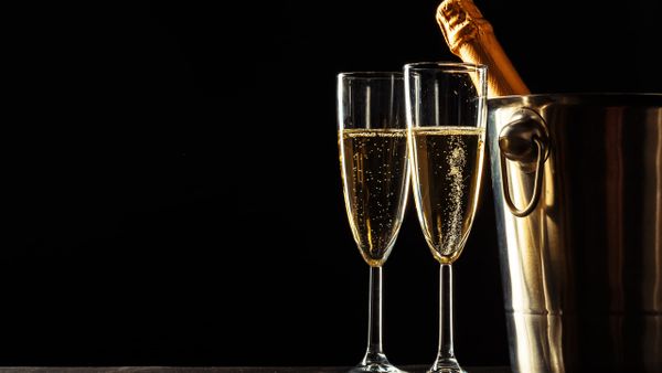 Champagne flutes with a bottle in an ice bucket